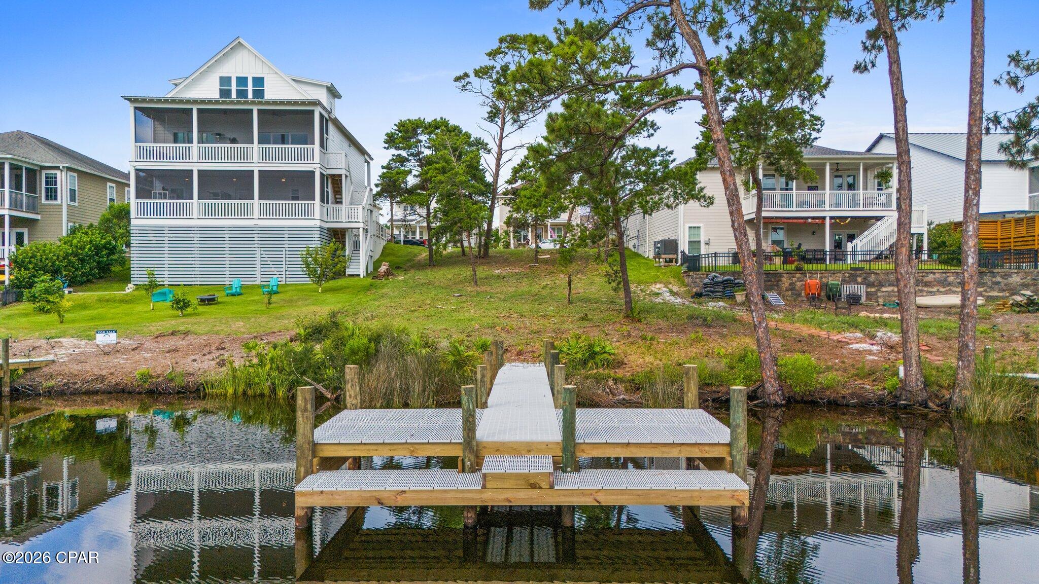 Tucked away in the serene, gated community of Turtle Cove at Lake Powell, this prime waterfront lot offers a rare opportunity to build your dream home in one of Florida's most peaceful and picturesque settings. With direct access to Lake Powell, Florida's largest coastal dune lake, this property includes community dock access, making it perfect for kayaking, paddleboarding, fishing, or simply soaking in breathtaking sunset views from the water. When the lake's natural outfall is open, residents can enjoy the unique opportunity to kayak or boat directly from Lake Powell to the Gulf of Mexico, offering an exceptional connection between the lake and the emerald waters of the coast. This is waterfront living at its finest, blending tranquility, recreation, and natural beauty in one remarkable location.

Spanning nearly 8,300 square feet, the lot provides ample space to design a custom retreat with room for outdoor living and panoramic water views. Mature trees lend privacy and natural charm, while the tranquil cul-de-sac location ensures peace and quiet.

Enjoy upscale amenities like a resort-style clubhouse, pool, fitness center, and tennis courts, all just minutes from the sugar-white sands of Panama City Beach and the charm of 30A.

Whether you envision a cozy lakeside cottage or a spacious modern escape, this property is ready to bring your coastal vision to life. Waterfront lots with this kind of access and setting are few and far between--don't miss your chance to claim a piece of paradise!