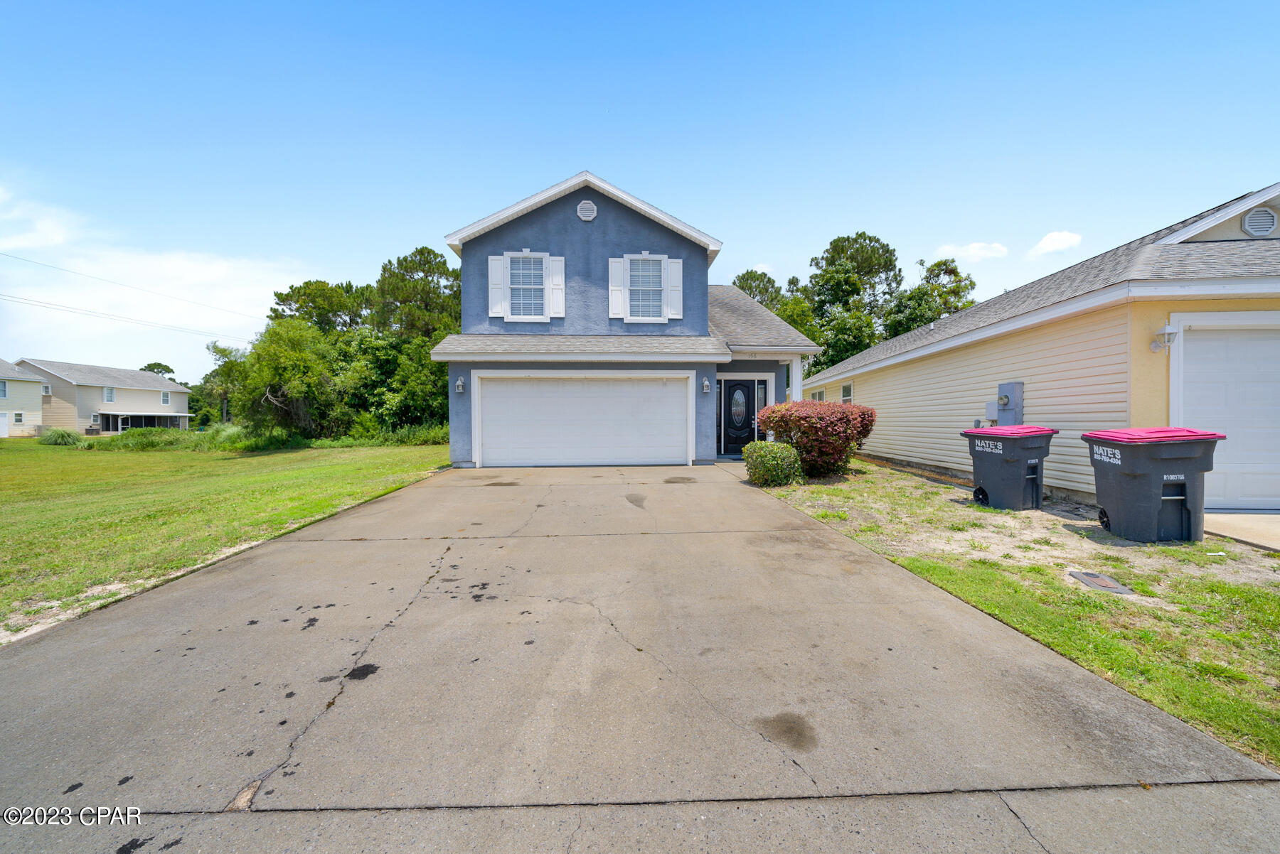 This 3 bedroom, 2 bath is in a great central location in PCB! Just enough space and no carpet to fool with! Newer Flooring and no carpet to fool with and freshly painted interiors! Relaxing Back Porch upstairs for lazy afternoons. This turn-key long term rental is located in a neighborhood half mile to the Gulf of Mexico and within minutes to the grocery store, medical care, restaurants etc. Palm Cove offers a neighborhood pool, playground and picnic area as well. Rent price includes basic lawn care and trash service.