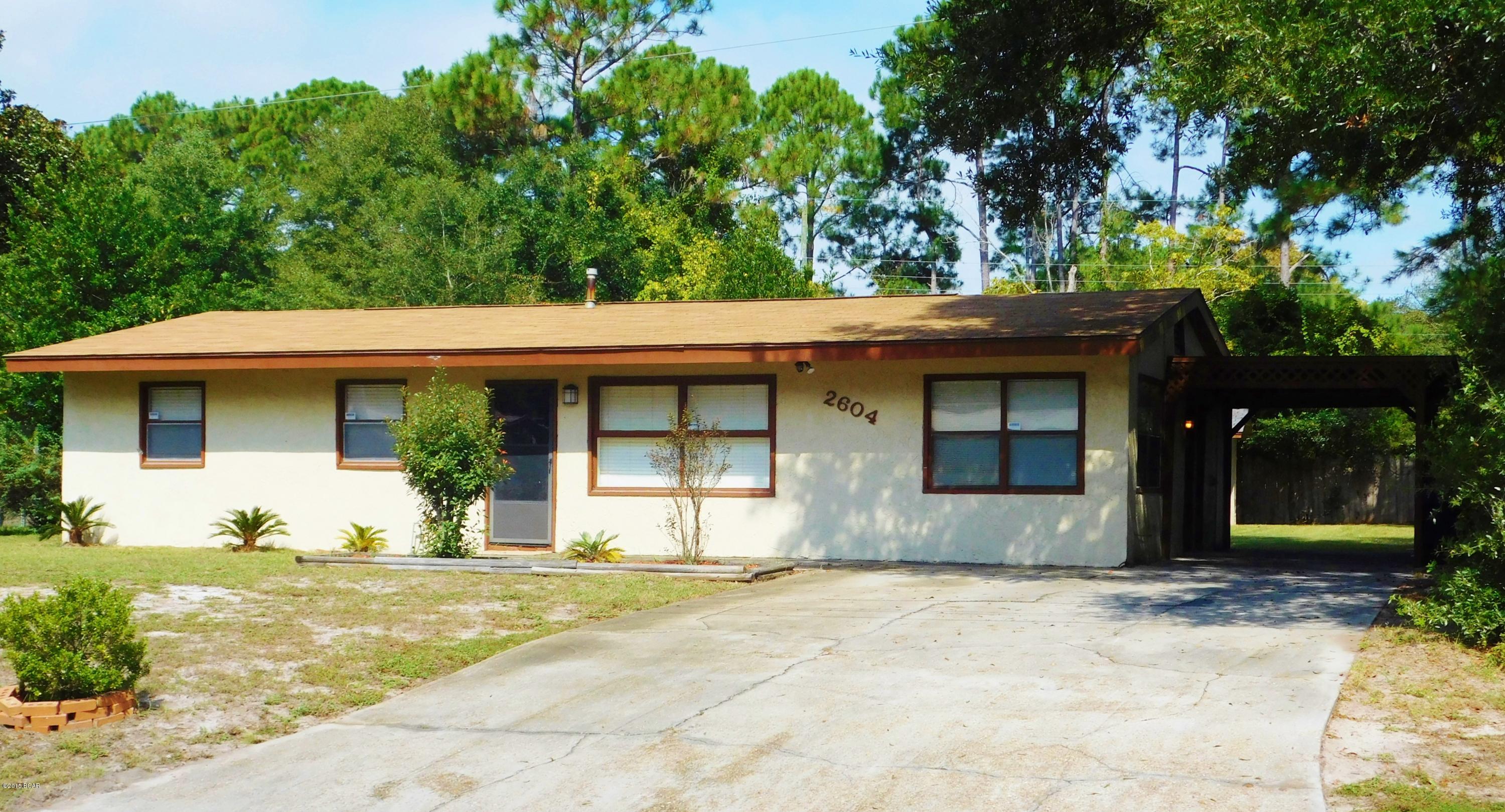 St. Andrews Charmer! In the heart of  Panama City, close to Gulf Coast College, Shopping, Hospitals, Restaurants and Medical Facilities!  This 3 bedroom 2 bath home is MOVE IN READY!  New carpet, freshly painted cabinets and clean as a whistle!  Large 12X14 sunroom on back of house with lots of natural light, plus formal living area and den.   Large 75X130' lot with outside storage room and shed, shallow well with sprinkler system. Security system in place.  Roof was replaced in 2005. Home has been very well maintained.  Call your REALTOR today for more info!
