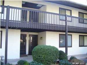 You'll love the intimate feel of this low density condominium nestled along the shore of beautiful Grand Lagoon...THIS LAGOON FRONT GROUND FLOOR unit has been totally REMODELED AND UPGRADED including 16'' tile throughout, rich granite counter tops, sinks, toilets, fixtures, maple cabinetry, lighting, and more! A/C replaced in 2009 inside and out. Point Lagoon offers dock with slips, covered gazebo, pool plus boat and wave runner storage! Age, SF and room sizes are approximate. Please verify if important.