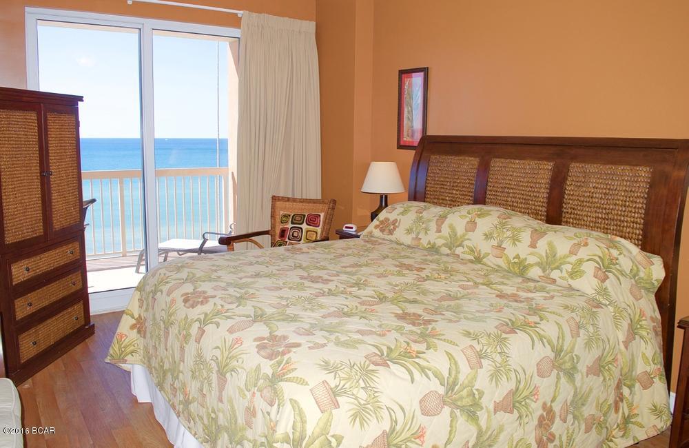This is the ultimate 2BR Sunrise Beach Resort condo. It features: Perfect floor location only 4 floors above the pool deck, Full size bunkroom, No carpet, Beautifully decorated, & RARE EXTERIOR OWNER'S CLOSET. This dream condo is located in the highly desirable Sunrise resort, which is one of the few PCB resorts with under resort parking, has low HOA fees, and is a top rental resort. This unit comes FULLY FURNISHED and RENTAL READY.  The large master bedroom faces the Gulf with private access to an oversized balcony, has separate his/her closets, and features a master en suite with double vanities and a large garden tub for relaxing after a hard day at the beach. Your guests will also enjoy their own beautifully decorated queen bedroom suite. And of course, the little ones... And of course, the little ones will really be excited to have their own private room with bunk beds and a TV/DVD player. This condo easily sleeps 6-8 with the living room sofa converting into a sleeper.The fully appointed kitchen features granite counter tops, a full sized pantry, and plenty of space to prepare your favorite vacation meals. The separate dining area is perfect for those formal family meals but also has a large granite kitchen bar that is available for those quick snacks for the kids. After a big day at the beach, the living area has been ideally furnished with a comfortable couch and love seat to enjoy your favorite movies on a large flat screen TV with DVD player. And, all bedrooms have upgraded with beautiful "wood plank" styled flooring. This condo is being offered fully furnished, and has a seasoned rental history. The Sunrise Beach Resort is centrally located to all the dining and entertainment PCB is famous for including spas, shopping, golf, fishing and more! Sunrise Beach has amazing resort style amenities, including: 346 feet on the Gulf of Mexico, Gulf front exercise room, covered parking in the garage under the building (NO PARKING ACROSS THE STREET!), 2 Gulf front swimming pools, 2 Gulf front jacuzzi's, children's mushroom play fountain, BBQ area with gas grills and more! Finally, the Sunrise HOA fees are among the most affordable on the beach and they even include full wireless internet throughout the resort. Sunrise is also owner controlled, which means the homeowners own the gym, the pools, and receive the income from the beach chairs, etc!  And, HOA fees are some of the lowest on the beach. NOTE: ALL INFORMATION AND MEASUREMENTS ARE DEEMED RELIABLE HOWEVER NOT GUARANTEED. BUYER SHOULD CONFIRM ALL INFORMATION.