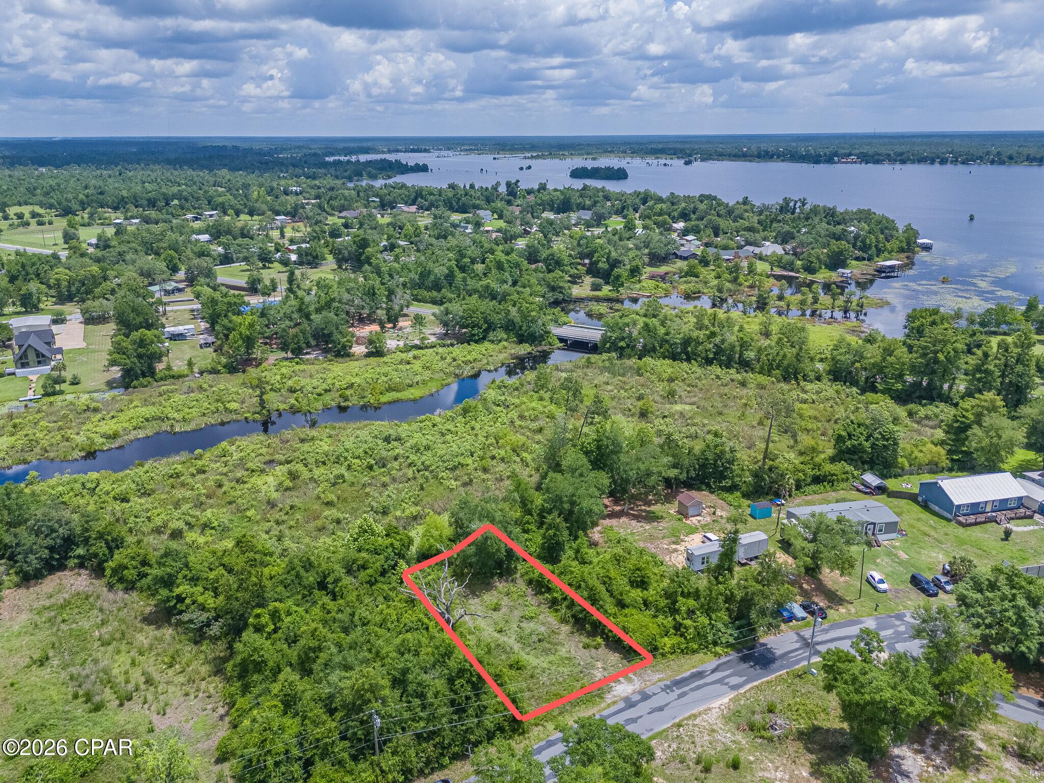 Discover the opportunity to build your dream home on this waterfront residential lot in the peaceful Southport area. Positioned along a creek that flows directly into Deer Point Lake, this property offers a unique setting where nature, recreation, and waterfront living come together.

Enjoy the sights and sounds of the water right from your backyard, with easy access to one of Bay County's most treasured freshwater destinations. Deer Point Lake spans thousands of acres and is well known for boating, kayaking, canoeing, paddleboarding, fishing, and wildlife viewing. The creek frontage provides a scenic backdrop while creating a direct connection to the expansive waters of the lake.

Whether you're looking for a private homesite, a weekend retreat, or a place to enjoy Florida's outdoor lifestyle year-round, this property delivers a rare opportunity to own waterfront land with access to Deer Point Lake's vast network of waterways. Spend your days fishing for bass, bream, and crappie, exploring the shoreline by kayak, or simply relaxing while taking in the natural beauty that surrounds you.

Conveniently located just a short drive from Panama City, Lynn Haven, schools, shopping, and dining, this waterfront property offers the perfect balance of privacy and accessibility. Build the home you've always envisioned and enjoy the waterfront lifestyle that makes this area so special.
