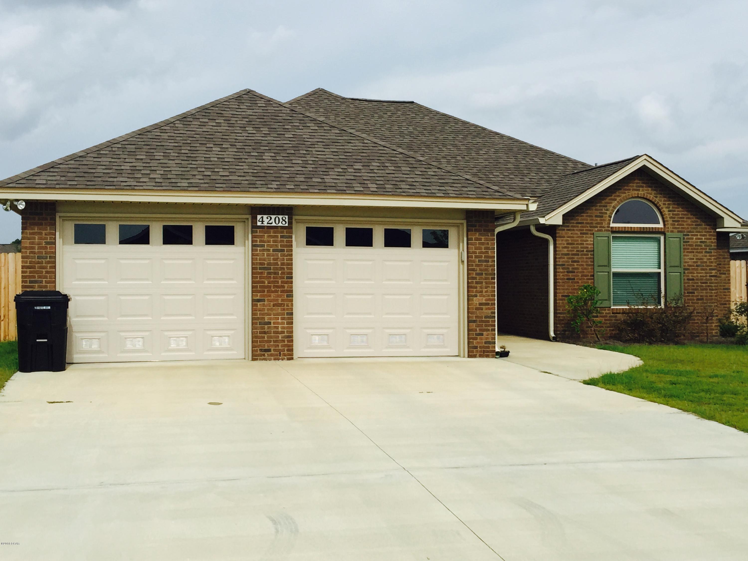 : This Custom Built Home Has3 bedroom 2 bath all brick home that offers master bath with his & hers double shower with two heads and shower seats on both ends, and walk in closet. The kitchen is a dream with all wood cabinets, solid surface counter tops, and stainless steel appliances. There are cabinets in the laundry room. Living room with and electric fire place and crown molding. Outdoors there is an enclosed screen patio and outside shower, and sprinkler system. Home is built to 130 MPH wind code.