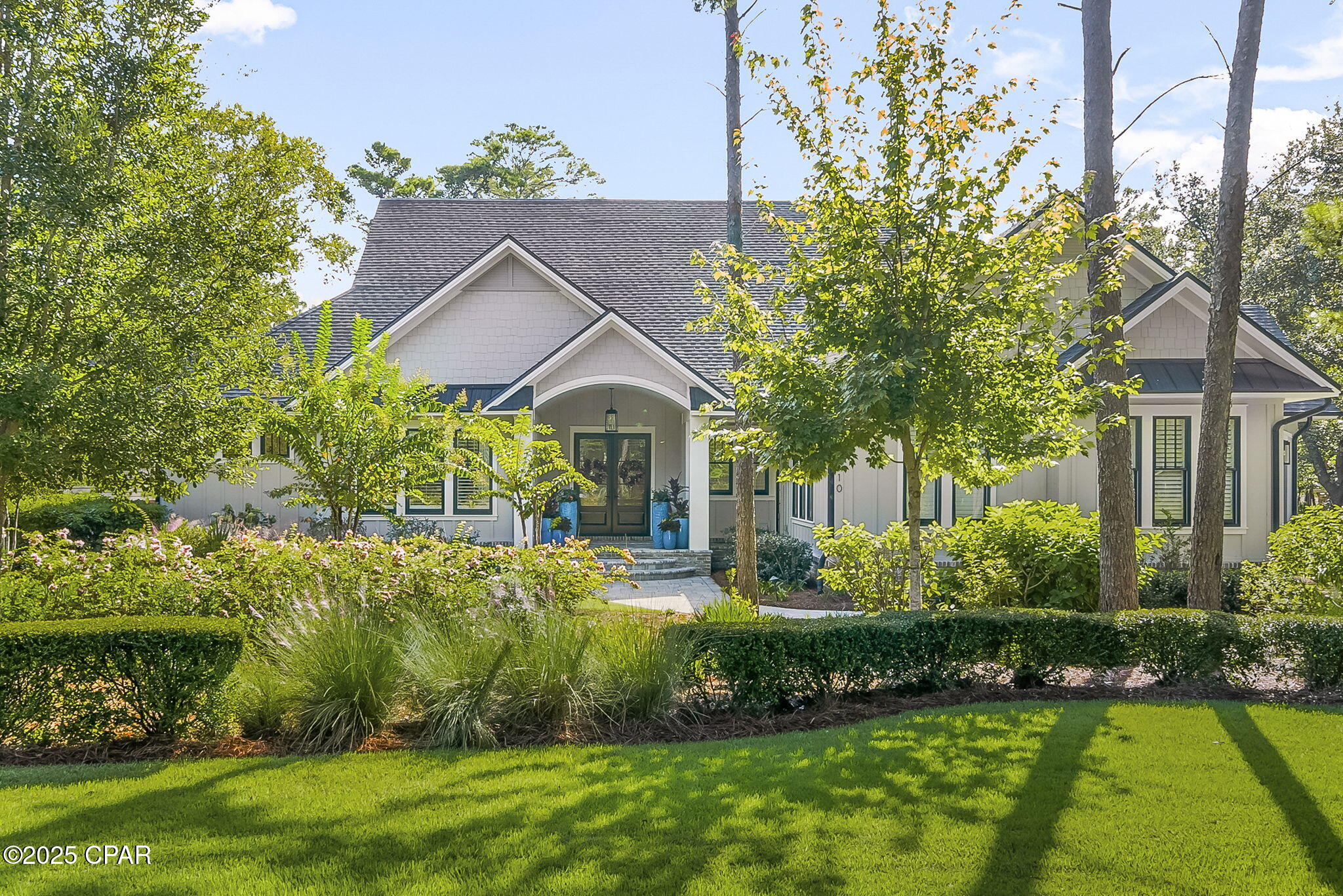 Welcome to Wild Heron, 1610 Sharks Tooth Trail as you can own this 3606 sq ft heated/cooled home which is a builders personal residence which contains numerous upgrades.  Wild Heron brings you back to nature and this home has extended living space of 795 sq ft.  Enjoy your afternoon listening to the birds, watching the humming birds or you might even see a deer in the late afternoon.   This extended living has an equipped kitchen for your cookout and as you step out of the porch you can enjoy the fire pit which is perfect for relaxing.  The yard
is a nature lover's delight with an abundance of landscaping encompassing the home.  Wild Heron is know for being on Lake Powell which is Florida's largest coastal dune lake.  
In addition the property features beautifully landscaped grounds with mature trees and native plants that enhance the tranquil setting.   The spacious backyard offers plenty of room for outdoor games or gardening, making it ideal for gathers with family and friends.  Additionally, the community offers walking trails and access to vrious amentiies, including a pool, hot tub nd fitness center.  Residents enjoy a peaceful atmosphere while still being close to local shops, restaurants and beautiful beaches, providing the perfect blend of convenience and natural beauty.  It is a short distance to the beach and also 30A which is the best of two words.   As you step into the living area your eyes will be drawn to the custom designed ceiling, accent fire place, large glass doors with a view on the back entertaining are and features a brick wall opening into the kitchen and dining area.   Custom cabinets, quartz countertops,  upscale appliances and a tiled wall make the kitchen a chiefs delight.  This home features four bedrooms and three baths.  There are three bedrooms on this side of the house and one bedroom currently serves as a den - a perfect retreat for watching TV, reading or enjoying a quick nap.  This room showcases shiplap, a vaulted ceiling and a wall of windows that fille the space with natural light.  Their are two other spacious bedrooms, one with a private bath.  The oversized master bedroom has wood flooring that extends throughout the home, except in the baths and laundry room which features custom tile.  The master suite includes two large closets and a spacious bathroom with dual vanities and offers a luxurious escape from daily life.  The master bath is designed to pamper, featuring a spacious walk in shower with premium fixtures and elegant tile work.  Thoughtful details create a spa-like atmosphere were you can unwind in comfort and style.  What a perfect office complete with bookshelves, file cabinet drawers and desk for two joined with a work area that overlooks the peaceful front yard.  This workspace is ideal for remote work or creative projects, bathed i natural light and offering a quiet environment to boost productivity and focus.  The laundry room consists of cabinet with granite countertops with tile back splash, closet area for hanging clothes and a refrigerator.  Additionally, energy-efficient windows and modern insulation contribute to the home's year-round comfort and lower utility costs.  
The thoughtful floor plan ensures privacy for guest and family member alike, making it ideal for hosing visitors or accommodating multi-generational living.  Generous storage solutions, including walk-in closets and built-in shelving, add to the home's functionality without sacrificing is elegant style.  Every detail has been carefully considered to blend comfort and sophistication throughout the living spaces.  Call today to tour this property and make it your home and start making memories.  Listing agent is a licensed FL Real Estate Broker and owner.