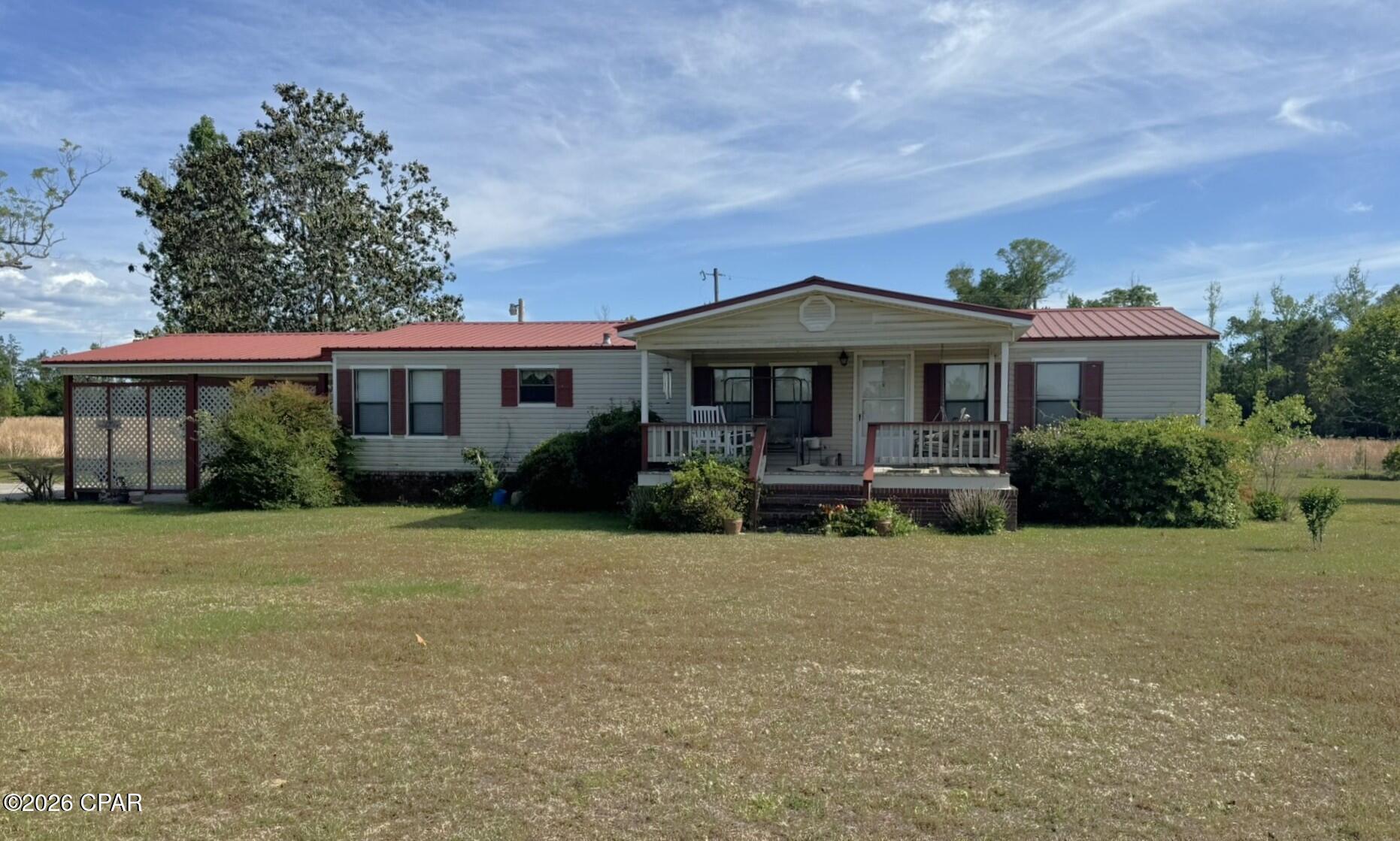 This three-bedroom, two-bath mobile home is situated on approximately 9.5 acres in a private, peaceful country setting. The property is fenced and partially cross-fenced, making it ideal for animals or small livestock, with no restrictions.
Outdoor amenities include a 12 x 20 storage shed and a 10 x 15 metal shed, providing ample storage and workspace options. The home also features an attached carport and a 22 x 12 screened porch overlooking the natural surroundings, perfect for relaxing and enjoying the quiet setting.
The HVAC is approximately 12 years old, with the roof replaced in 2018. Inside, the floor plan offers a comfortable split-bedroom layout. The spacious primary suite includes a large bathroom with a soaking tub, separate shower, and dual vanities. The additional bedrooms are generously sized and feature large walk-in closets.
The kitchen is equipped with a stove, refrigerator, and dishwasher, and the living area includes a gas fireplace for added warmth and comfort.
According to the Property Appraiser's website, the parcel is listed at 21.35 acres; however, a recent survey has reduced the acreage to approximately 9.5 acres, offering a more accurate and affordable tract while still providing substantial land and privacy.
All measurements are approximate and should be verified by the buyer.