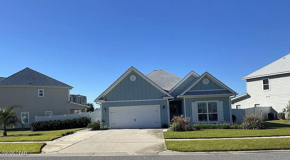 LOCATION LOCATION LOCATION! Enjoy serene water views from the back porch, featuring a spacious in-law/guest suite with private entrance, and a fenced yard perfect for privacy and pets.  Welcome home to Moonraker Circle! This home is 5/10ths of a mile to the M.B. Miller county pier with beautiful beaches all around and close to restaurants, gyms, major grocery chains, home improvement centers, Shipwreck Island, and so much more. Don't miss the opportunity to own this unique 4 bedroom 3 bath home as it has an inlaw/guest suite under the same roof as the main home with a private exterior entrance and also a connecting door inside the main home. This home is situated on a .18 acre lot on a neighborhood pond with a nice view and relaxing sounds of a fountain. A screened back porch looks out onto the pond for either those mornings with a cup of coffee or a leisure evening with a glass of wine looking for a sunset. The exterior of the home was repainted in December 2024 with other interior rooms painted in the fall of 2025. The main part of the home is a 3 bedroom 2 full bath split plan with an open floor plan consisting of a living, dining and kitchen area. The master bedroom is 14' x 16' and the master bathroom includes a double vanity with a large walk-in closet, garden tub, shower and separate toilet room. The other 2 bedrooms share a full bath with each bedroom having a walk in closet. A separate laundry room with laundry cabinets accommodates full size washer/dryer units. The in-law/guest suite has a 12' x 11' 2'' bedroom, a bathroom offering a large walk-in shower with a laundry closet sized for a stack washer/dryer unit. It has an open floor plan consisting of a full kitchen w/dining area and living room. This home has a two car garage with a separate parking area adjacent to the driveway for a third vehicle. The total area of this home is 2862 sq. ft. under roof with 2191 heated/cooled sq ft. The main home has Shaw luxury vinyl plank (grey oak) in all parts of the home except for the two bedrooms which were re-carpeted in January 2025. The in-law/guest suite has the same Shaw luxury vinyl plank throughout. Crown molding is installed in the main areas of the house with 3'' Plantation shutters installed on all windows in the main home. Added conveniences with this home are a keyless entry on the front door, a Wyze ring doorbell camera along with a Wyze PTZ camera on the front driveway and road area. It has a fenced yard with low voltage lighting on the back and side yards. Moonraker Circle does have an HOA with $400/quarterly dues which provides for maintenance of a community pool and bathrooms, with a grill and covered area for cookouts. Moonraker Circle is a pet friendly neighborhood with two doggie stations and a dog park. There are approximately 4.3 acres of common area grounds, including the dog park, the Association maintains as well. Some photos have been virtually rendered.