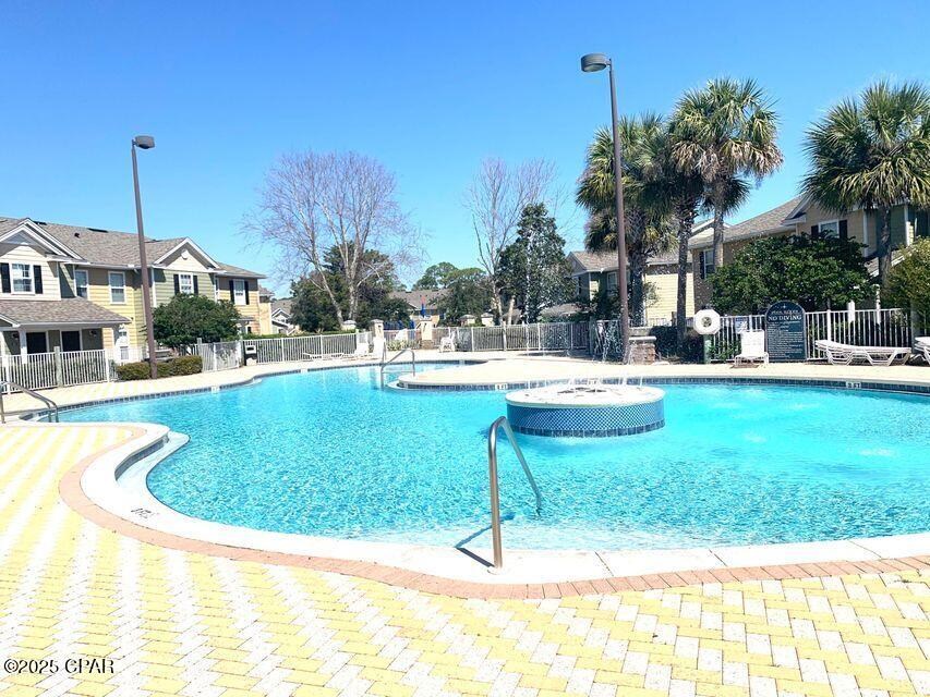 Furnished condo off PC Parkway.  Everything you need, towels, linens, pots, pans, dishes, coffee pot, Washer & Dryer. There's a large pool and area. Playground, outdoor grills and green spaces. Walk to shopping and dining. Beach is less than a mile. There's one assigned parking space, but if you need another there's open parking with a permit.