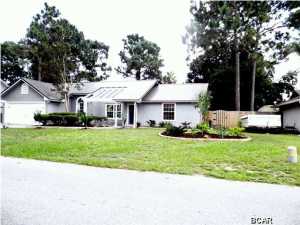Beautiful Home in a Quiet Neighborhood in Treasure Palms with a new Metal Roof has a split bedroom plan. Large Great Room has an Open Floor Plan with Cathedral Ceilings, Laminate Hardwood Floors and Fireplace. Master suite has large walk in closet, (12.5 feet by 6 feet). Other two Bedrooms are Good size Bedrooms. Seller have Painted all Cabinets, exterior and interior walls. They have replace the Water Heater (this year), Refrigerator, Microwave, Sink and Spout. The bathrooms updates include all Hardware: Knobs, Handles, and Spiral Door Handles. French doors opens to the screened back porch with a Hot Tub which is great way to relax. Nice big back yard with a privacy fence and a Sprinkler System. The spacious laundry room has plenty of room for a freeze or whatever extra room you