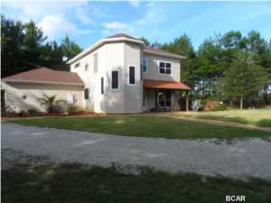 Looking for room to spread out and a quiet place to enjoy nature? Come Home to this 5+ Acre Country Estate , just a quick drive to town, the Airport and the Beaches. With over 3000 sq Feet of Living Space, there is room for everyone in this 4 bedroom Builder's Custom Home. The Living and Dining areas have warm tile flooring and neutral colors. Over sized windows let the Natural Light come in , making the spaces ''light and bright''. A Family Friendly Game Room gives that extra space for Movies, a Pool Table or Hobbies and is located just off the main living area. The first floor bedroom is perfect for guests or a home office. A dramatic staircase leads to the upper level and 3 bedrooms, including the Master Suite. You'll enjoy your own private retreat complete with its own Balcony an