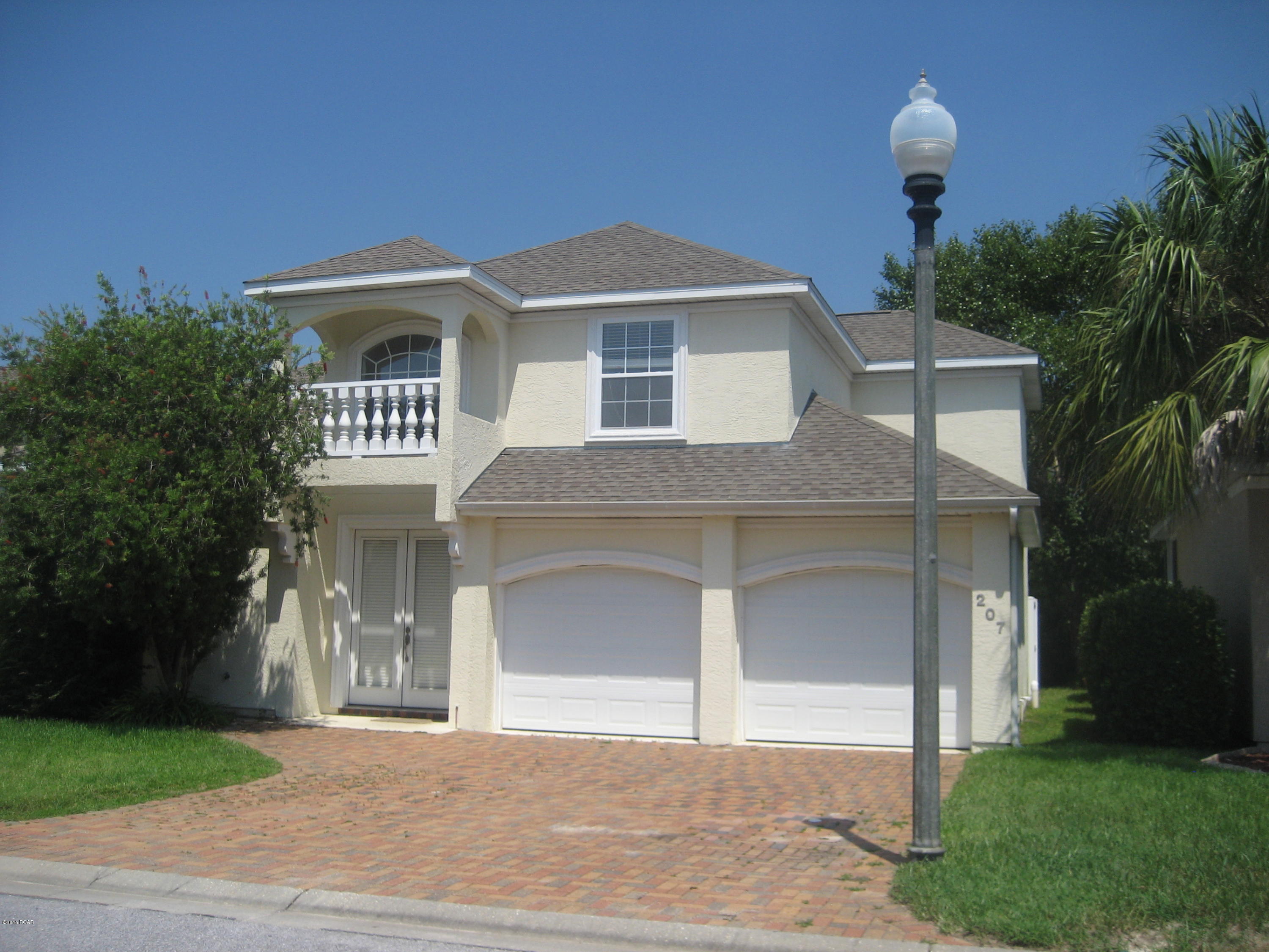 This beautiful four bedroom two and half bath house has many upgrades including custom cabinets, tile downstairs, hardwood floors on stairway and hall upstairs, mirrored closet doors. Downstairs master suite, bath has garden tub, separate shower and double vanities. Screened pool can be accessed from master bedroom. Back of lot is wooded which provides privacy. 2 car garage with openers, Pool service and lawn care are included.  Sorry, no pets.