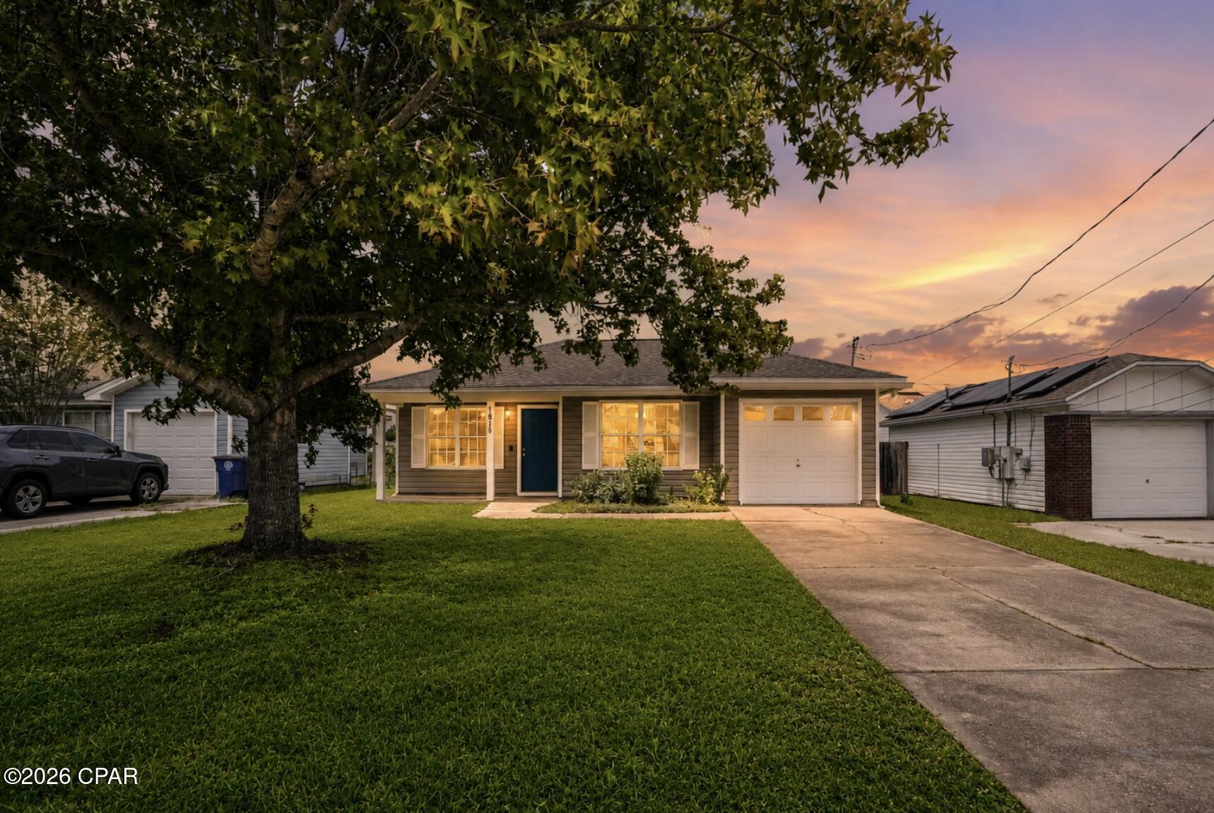 Charming 3-bedroom, 2-bath home in central Panama City! This well-maintained home features durable wood-look tile flooring, granite countertops, an inviting fireplace, a one-car garage, and a spacious backyard. Full kitchen with updated appliances, and backsplash with a bar to add stools. Main bedroom has a view of the backyard and an en suite. Close to shopping, dining, beach, schools, and Tyndall AFB, this home offers comfort and convenience. Schedule your showing today!