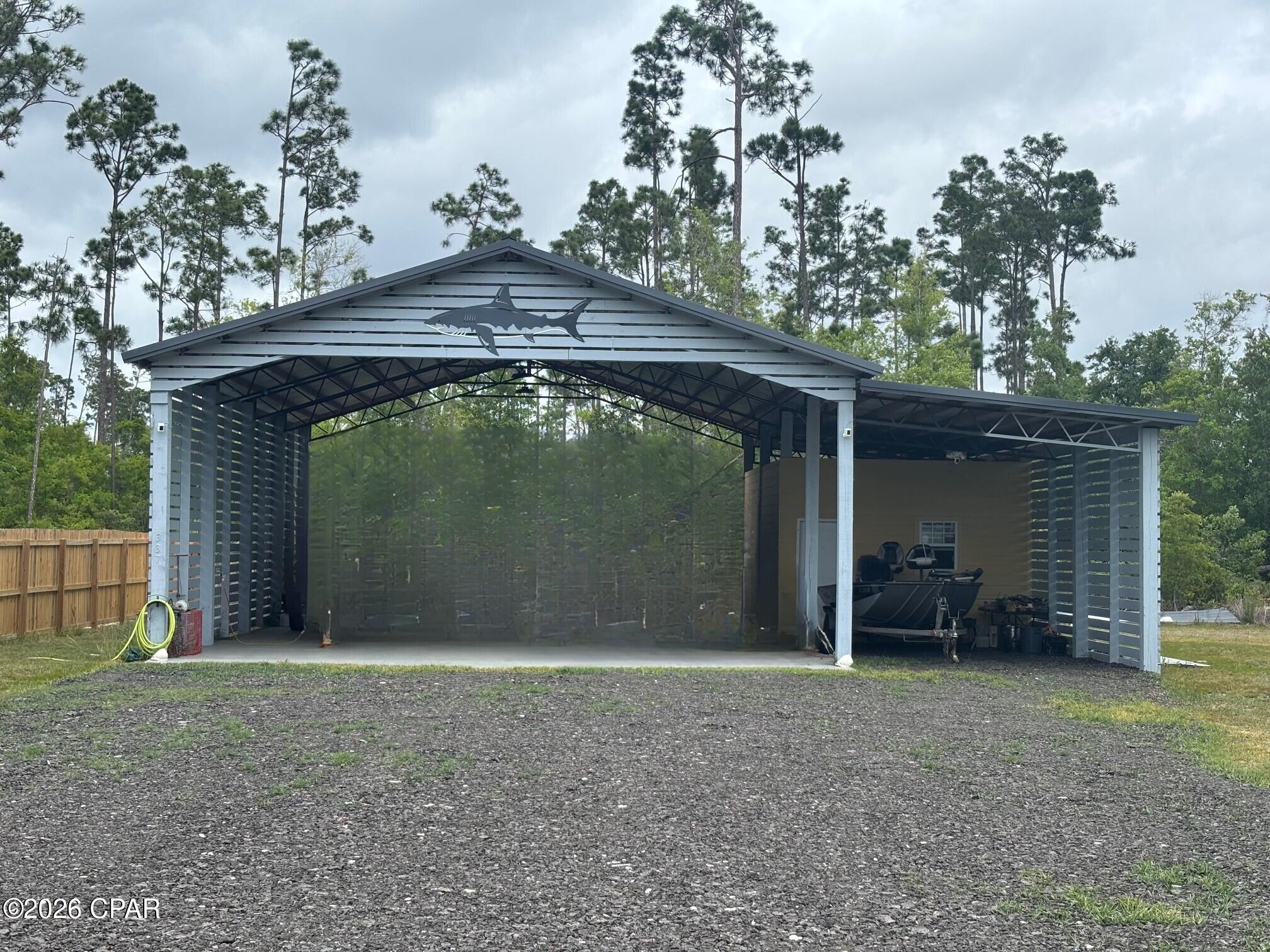 An excellent opportunity to own a versatile property just under 1/2 acre on desirable Firehouse Lane in Port St. Joe, located only blocks from the Intracoastal Waterway, boat launch, and some of the area's best fishing. This property offers a functional setup ideal for immediate use or future expansion.

The property features a spacious pole barn, perfect for covering your RV, boat, or equipment, along with existing RV hookups for added convenience. A studio is currently under construction and planned to include a bathroom, kitchen, sleeping area, and living space--offering great potential for guest accommodations, rental income, or a private retreat once completed.

A small shed is also included and provides additional storage or the opportunity to convert into a workshop or additional usable space. Whether you're looking for a weekend getaway, investment opportunity, or future homesite, this property offers flexibility to fit your vision.

Enjoy the quiet coastal lifestyle with a short drive (approximately 5 miles) to Mexico Beach for boating, fishing, and beachside relaxation. Gulf County allows RVs, mobile homes, or site-built homes, making this a prime location for your next venture.