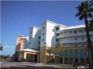 This is a top floor unit - freshly painted - in great condition. The carpeting has been replaced with tile floors. It is a one bedroom, 1 bath unit with separate sitting area and efficiency kitchen. The balcony has ample room for table and chairs and a chaise longue. The views from this unit are quite spectacular - overlooking Lake Carillon and the Gulf of Mexico. As an owner of this unit, you are a part of the community of Carillon Beach and, as such, are entitled to use all of the amenities - four swimming pools, hot tubs, play grounds, tennis courts, basketball court and over 3,900 front feet of sandy sugar beaches with eight access walkovers.
