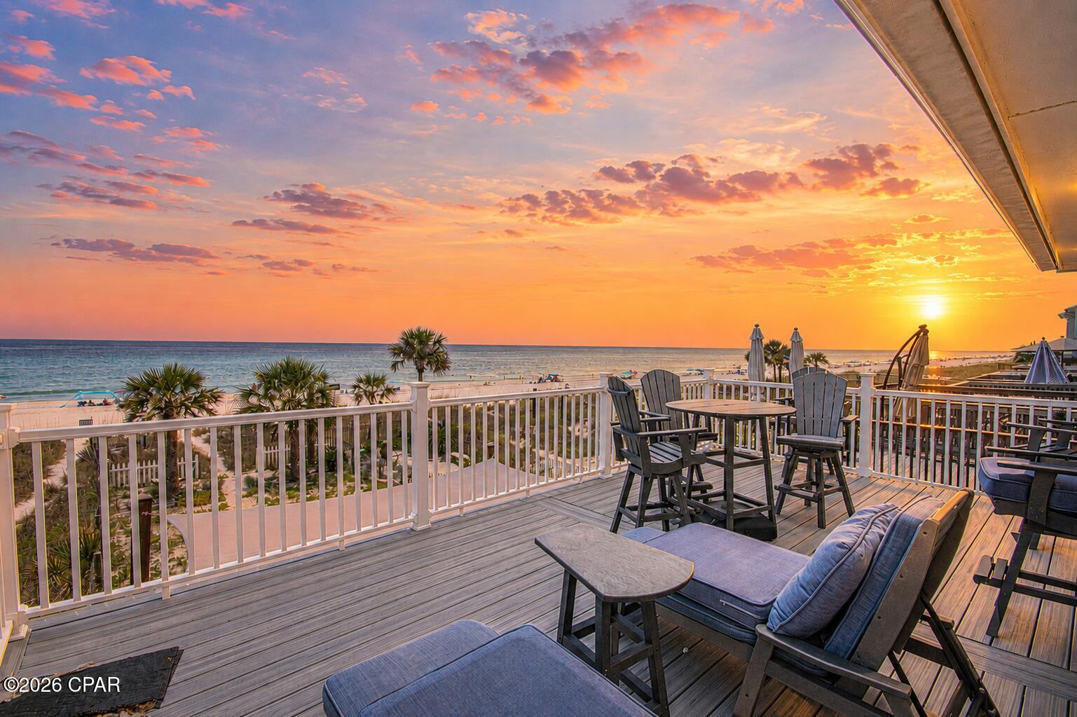 3BR/2.5BA Gulf-front townhome in Laguna Beach, Panama City Beach. No HOA. 25' of beachfront, 2,128 SF, fully furnished and truly turnkey. Perfectly positioned along the sugar-white sands of Laguna Beach, this beautifully renovated Gulf-front townhome offers a rare opportunity to own 25 feet of direct Gulf frontage with no HOA fees. Offering approximately 2,128 square feet, this fully furnished three-bedroom, two-and-a-half-bath residence has been thoughtfully updated throughout, creating a move-in-ready and rental-ready property where every major improvement has already been completed. The moment you step inside, the Gulf becomes the centerpiece of the home. The expansive open-concept living, dining, and kitchen area was designed to maximize both space and the spectacular waterfront setting. A wide wall of windows and glass sliding doors stretches across the rear of the home, filling the interior with natural light while framing breathtaking Gulf views. The beautifully renovated kitchen features quartz countertops, a large island with breakfast bar seating, stainless steel appliances, a gas range, wine refrigerator, generous cabinetry, and abundant workspace, making it equally suited for everyday living and entertaining. All three bedrooms are located upstairs for added privacy. The Gulf-front primary suite opens directly onto the expansive 22.5' x 13.5' beachfront deck through glass sliding doors, while an adjoining wall of windows showcases panoramic Gulf views. The second bedroom also enjoys direct access to the same oversized deck and features expansive Gulf-facing windows. The third bedroom is furnished with bunk beds for additional guest accommodations. All bathrooms have been beautifully renovated. The primary bath features a spacious walk-in double shower, while the second full bath offers a tub/shower combination with convenient access from both the hallway and second bedroom. The spacious main living area offers additional flexibility with a sleeper sofa and generous open space for hosting overnight guests. Outside, the covered lower deck includes durable outdoor furnishings and an outdoor shower. Beyond the deck, approximately 48 feet of additional Gulf-front outdoor space extends to the property line, providing room for outdoor entertaining, a fire pit, games, landscaping, or simply enjoying the open beachfront setting. Upstairs, the oversized deck provides another incredible place to enjoy morning coffee, coastal breezes, and unforgettable sunsets. Recent improvements include a dimensional shingle roof installed in 2023, Hardie Board exterior siding completed in 2021, tile flooring throughout, and beautifully renovated bathrooms. High-end furnishings, appliances, décor, kitchenware, and outdoor furnishings all convey with the sale, allowing the next owner to simply arrive and begin enjoying the property immediately. A one-car garage and an interior storage room with a full-size washer and dryer provide valuable storage for beach equipment and everyday convenience. Located on the quiet west end of Panama City Beach, Laguna Beach offers a relaxed coastal setting while remaining close to shopping, dining, and entertainment. Thomas Donut & Snack Shop and Carousel Supermarket are just a short distance away. Beachfront properties offering direct Gulf frontage, generous living space, quality renovations, furnishings that convey, short-term rental eligibility, and the added financial advantage of no HOA fees are increasingly difficult to find. This is a rare opportunity to own a beautifully updated beachfront home where every detail has already been thoughtfully completed. Simply arrive, unpack, and let the Gulf become part of your everyday life.