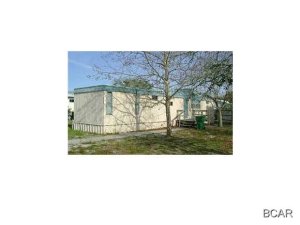 Open floor plan, breakfast bar, split bedroom plan, washer/dryer connections, and walking distance to the beach!