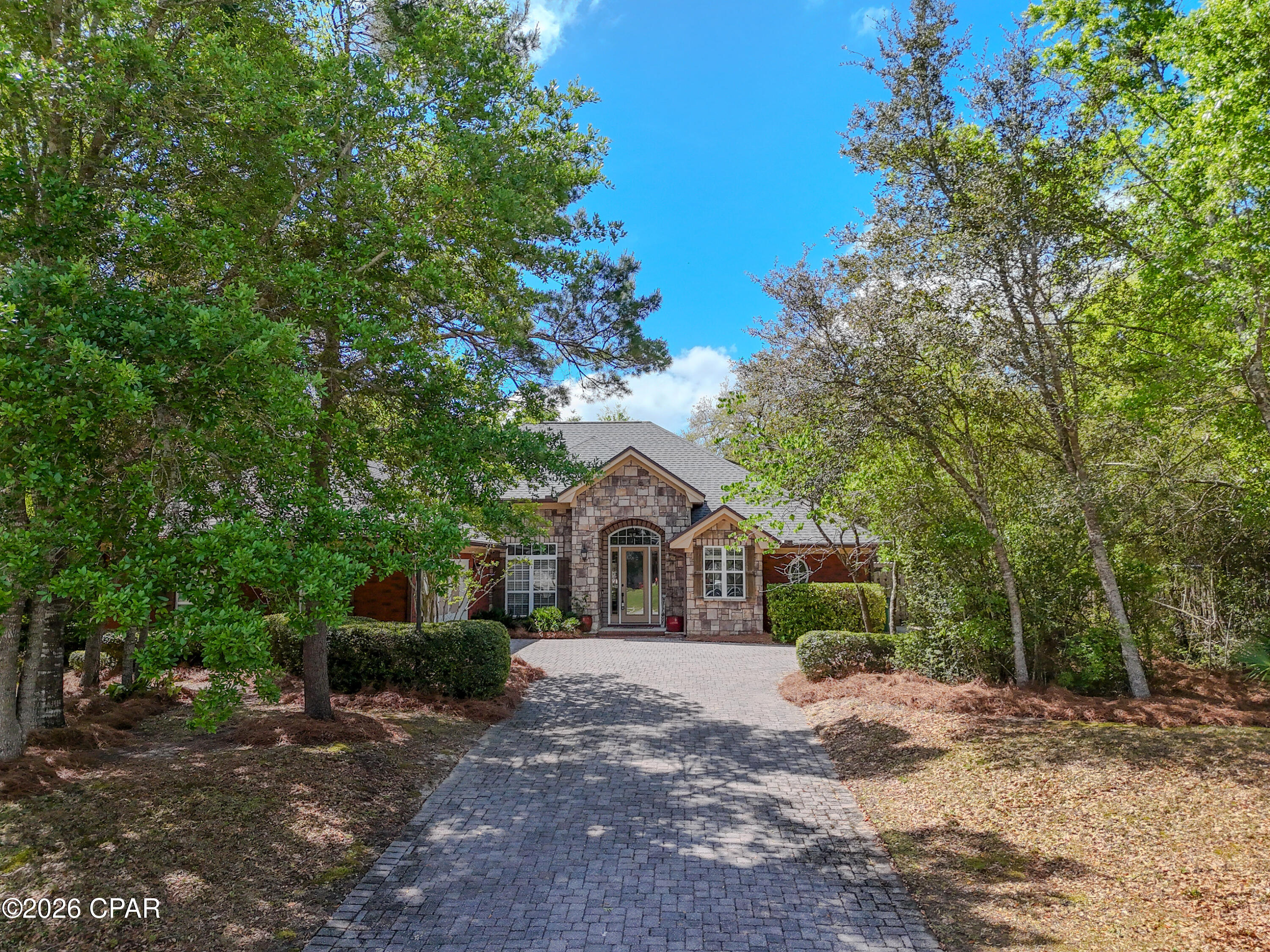 Nestled within the gated community of Lake Merial, this beautifully designed home sits on an expansive .57 -acre wooded homesite, offering exceptional privacy, space, and timeless appeal. With room for a pool, outdoor kitchen, or private backyard retreat, the oversized lot creates a true estate feel. Surrounded by natural beauty and elegant custom homes, this property offers the perfect blend of refined living and relaxed Florida lifestyle. A rare opportunity to own a generous homesite in one of the area's most sought after lake communities. Just minutes from the Northwest Florida Beaches International Airport, making travel effortless while preserving the serenity of home. Easy lock and leave luxury awaits at 140 Lake Merial Trail.