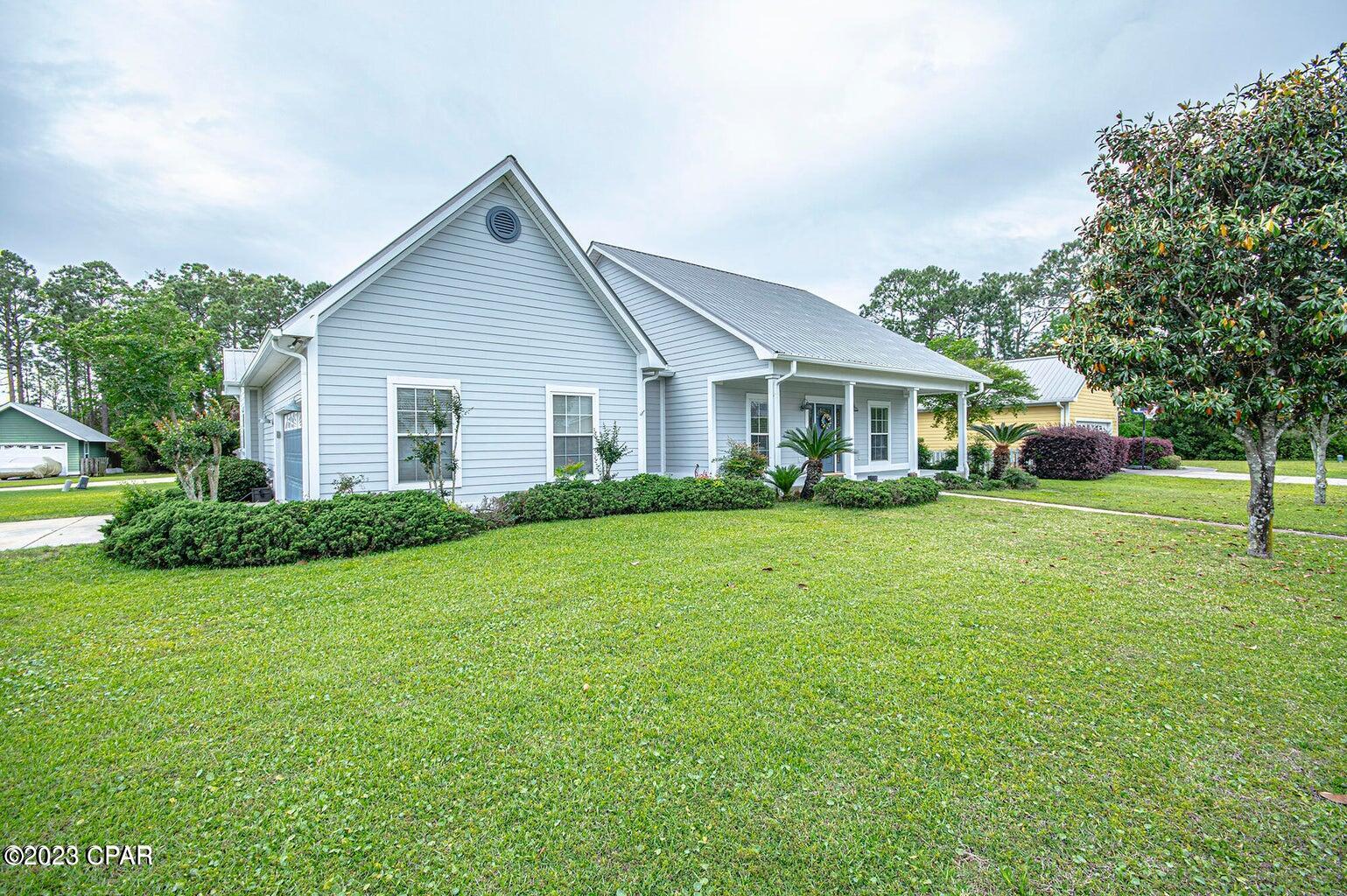 Beautiful Craftsman home located in the center of Panama City Beach. Subdivision is Craftsman themed community. This home features a large front and back porch, formal dining room, great room with raised ceilings, breakfast bar and fire place. Large backyard outdoor activities. Upgraded master bath to over sized walk-in closet, large shower. All tile flooring throughout the home, carpet in bedrooms. New paint and light fixtures.