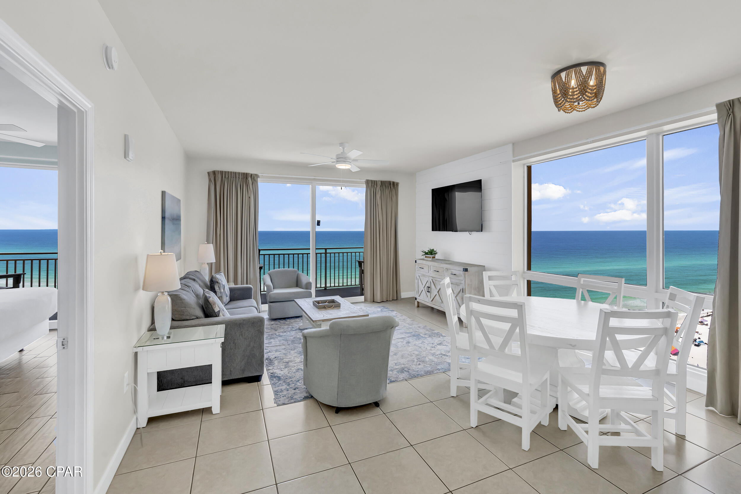 Wake up to panoramic gulf views stretching across the horizon from nearly every room in this rare ''Paradise'' floor plan at Splash Resort -- a highly desirable 9th-floor corner unit on the gulf. As a west-facing corner unit, this condo captures stunning emerald water views from multiple vantage points, with floor-to-ceiling windows and additional side windows flooding the space with natural light and creating a bright, airy atmosphere few beachfront condos can match.
The versatile 3BR/3BA layout sleeps up to 10 guests and features a unique lockout suite configuration that sets this property apart from nearly everything else on the beach. The third bedroom functions as a fully self-contained private studio with its own entrance, wet bar, kitchenette, sitting area, and private balcony -- allowing owners to rent the property as a complete 3BR unit or simultaneously as a 2BR/2BA condo and a separate studio suite. This dual-rental flexibility dramatically expands income potential and gives owners options that a standard floor plan simply cannot offer. Two gulf-front primary suites positioned on opposite ends of the condo provide privacy and comfort for guests, making the layout equally compelling as a vacation home, investment property, or both.
The open-concept living area keeps the focus where it belongs -- on the water. The living room, dining area, kitchen, and all three bedrooms look out to the beach and emerald Gulf beyond. The spacious kitchen features granite countertops, stainless steel appliances, and a breakfast bar that flows seamlessly into the living and dining spaces. Shiplap accent walls add character and a refined coastal touch throughout, while tile flooring delivers the low-maintenance durability beachfront living demands. The condo is being offered fully furnished and turnkey -- ready to rent or enjoy from day one.
Splash Resort is one of Panama City Beach's most popular gulf-front destinations, offering more than 400 feet of sugar-white sand and an impressive lineup of resort amenities: a beachfront kids water park with waterslides and lazy river, dive-in movies, arcade, fitness center, adult pool and hot tub, poolside bar and grill, BBQ area, covered parking, beach shop, and seasonal watersport rentals. The HOA is well-managed with strong reserves, and on-site amenity revenue helps offset operating costs for owners -- a meaningful advantage in today's market.
Positioned on the desirable west end of Panama City Beach, Splash Resort puts you just minutes from Pier Park, top restaurants, shopping, and entertainment while still offering the quieter, more relaxed beachfront feel that west-end buyers consistently seek.
Schedule your private showing today.