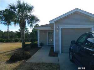 Sought after pond and tranquil nature view! This waterfront townhouse is an END UNIT in popular Palmetto Trace. It has an open flow, slit floor plan. Master bedroom features walk-in closet and big private bath. Spacious kitchen with moveable island, lots of cabinets and breakfast bar. The screened porch offers ready-to-enjoy outdoor living space. Large side yard for added privacy. In demand 1-car garage with pull down stairs to attic storage. Custom hurricane shutters included. Palmetto Trace is a prime community offering low HOA dues, two community pools, pavilions, pool house, sidewalks, underground utilities - a pet-friendly neighborhood with doggy stations. This neighborhood is walkable to the Gulf of Mexico beaches, Pier Park North, Frank Brown Park, state maintained trails.