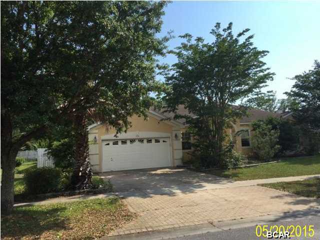Spacious three bedroom home in the beautiful community of Wood Run in Lynn Haven. Home is accented with crown molding and has tile throughout with carpet in all three bedrooms and bonus room. Master bedroom has French doors leading out to covered porch with screened in-ground pool (needs work). Exterior features include a privacy fenced back yard landscaped with fruit trees. Master bath has separate tub and shower plus double sink vanity. Home is being sold ''as-is'' and all information and measurements are to the best of our ability and should be confirmed for accuracy.