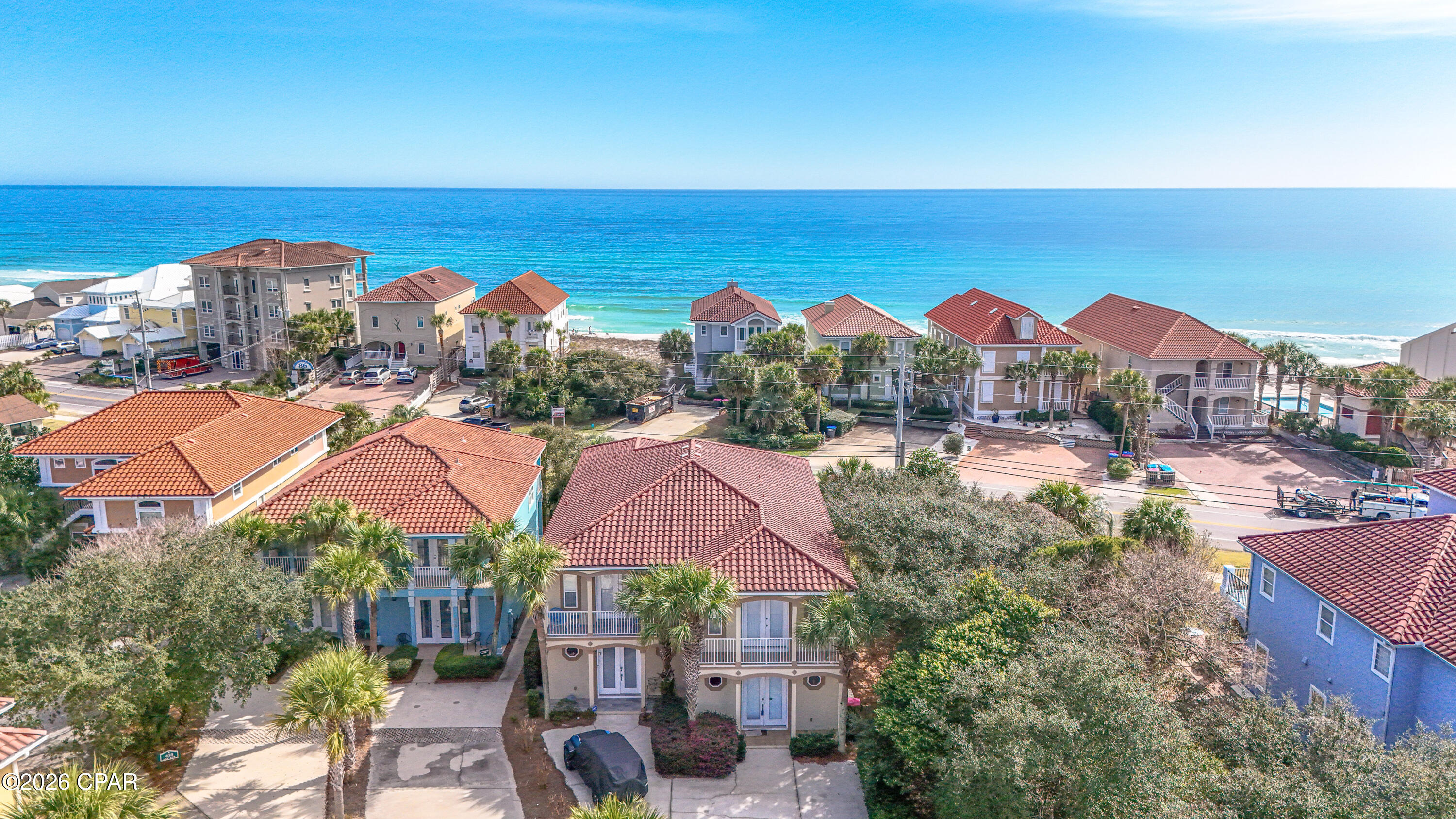 Welcome to this beautiful coastal home located on the desirable west end of Panama City Beach, close to 30A/Rosemary Beach, in the gated community of La Valencia.  Designed with a private beach resort feel the home is perfectly positioned directly across the street from the beach. This spacious 3 or 4 bedroom, 3.5 bathroom home offers gulf views, great indoor and outdoor living spaces, and a layout designed for relaxing and entertaining. The main living area features an open kitchen, dining, and living room layout that is bright and inviting. The kitchen is fully stocked and has custom cabinetry, generous counter space for meal prep or entertaining, and bar seating for four adjacent to dining seating for six. Just off the living room, you'll find a large covered balcony with gulf views, creating the perfect spot for morning coffee, evening sunset/cocktails, or enjoying that beachy breeze and the sounds of the surf! The primary suite is spacious and filled with natural light, with a private balcony so you can step outside and take in the views anytime. The ensuite bathroom features a dual vanity, soaking tub, and separate shower, creating a comfortable retreat. Downstairs, the home offers a separate living area complete with a sitting area, dining/game table, and wet bar with sink, mini fridge, dishwasher, ice maker, and microwave. This flexible space is perfect for entertaining after a beach day, serving as a fourth bedroom with sleeper sofa and private kitchenette, or creating a fun bunk/hangout area for kids. There is also patio access, making it easy to enjoy the outdoor space. The home features tile flooring in the main traffic areas downstairs and hardwood flooring in the main upstairs living areas, adding convenience for cleaning and durability!  Located in the gated La Valencia community, residents enjoy wonderful amenities including a heated owners pool, hot tub, clubhouse, fitness center, second gulf front pool,  private gated beach access, and a tennis/pickleball court. The clubhouse is complete with kitchen, restrooms, and gaming set up perfect for hosting game/poker night. The second pool is gulf front and has beautiful views of the Emerald Coast as well as restrooms and golf cart parking for added convenience. The location truly cannot be beat! You are conveniently located near Pier Park, the scenic 30A corridor, shopping, dining, and entertainment. Everyday conveniences are also close by with Aldi, Publix, and Walmart just minutes away.

With short term rentals allowed, gulf views, beach access directly across the street, and fantastic community amenities, this property offers a great opportunity for a primary residence, second home, or vacation rental investment in a wonderful area of Panama City Beach! Come see!