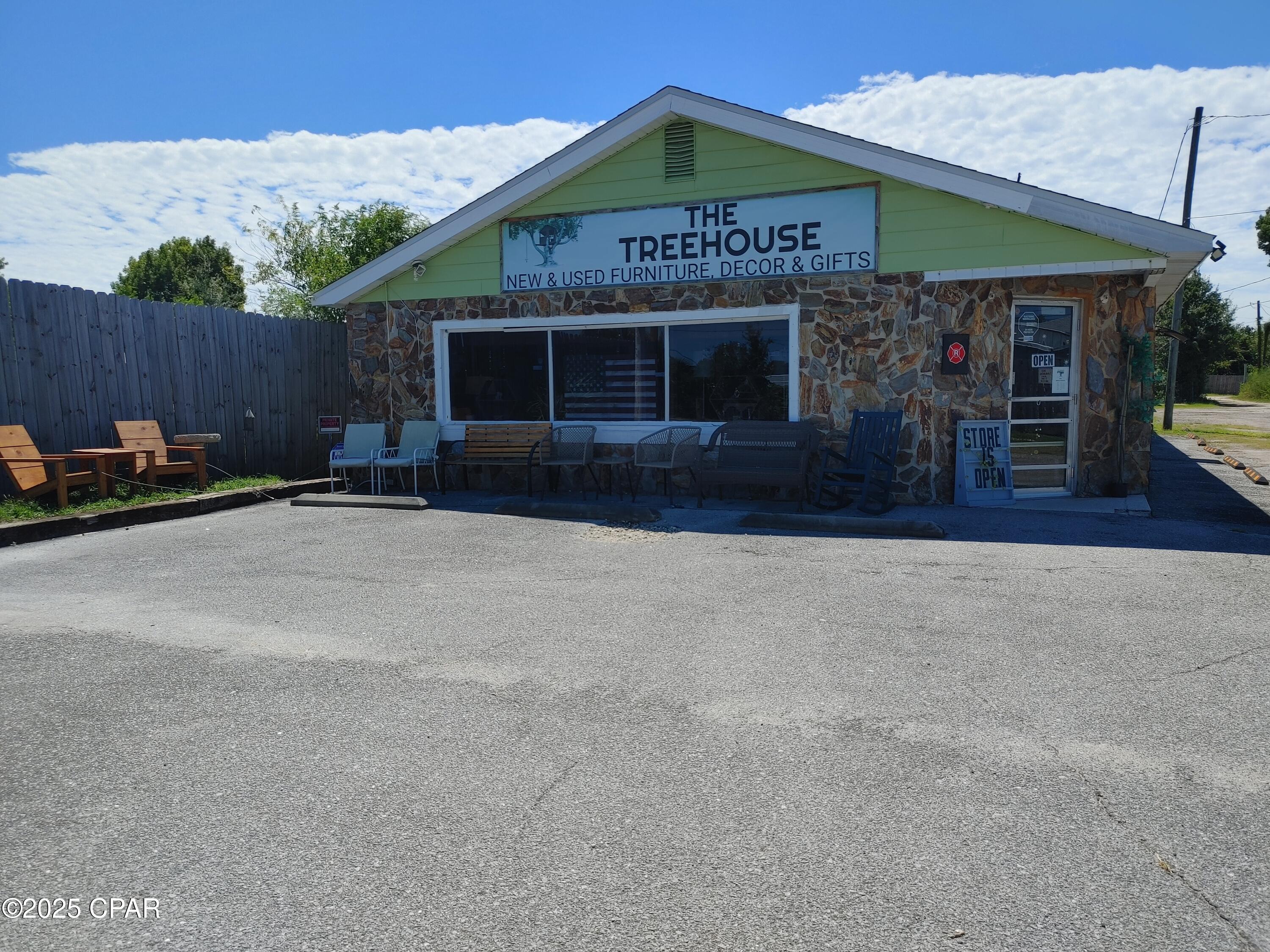 The Treehouse is an established new and used furniture store that also carries home decor, gifts and jewelry. Business has been in operation for 3 years and is growing and well received. The building has experienced much renovation and kept in its rustic charm and has 4 bathrooms total. Could easily be divided into 2-3 more businesses onsite as the building has 3 separate entrances. Lot features a large area at the back of the property perfect for parking large trucks or cars that need to be kept out of site. Roof was replaced after Hurricane Michael and the building has 3 mini split heat/air units that do the trick for comfortable shopping. Customers love the unique selection of merchandise offered. This listing is for the business, good will, inventory and real estate. The building alone and the business alone are listed separately in MLS system.