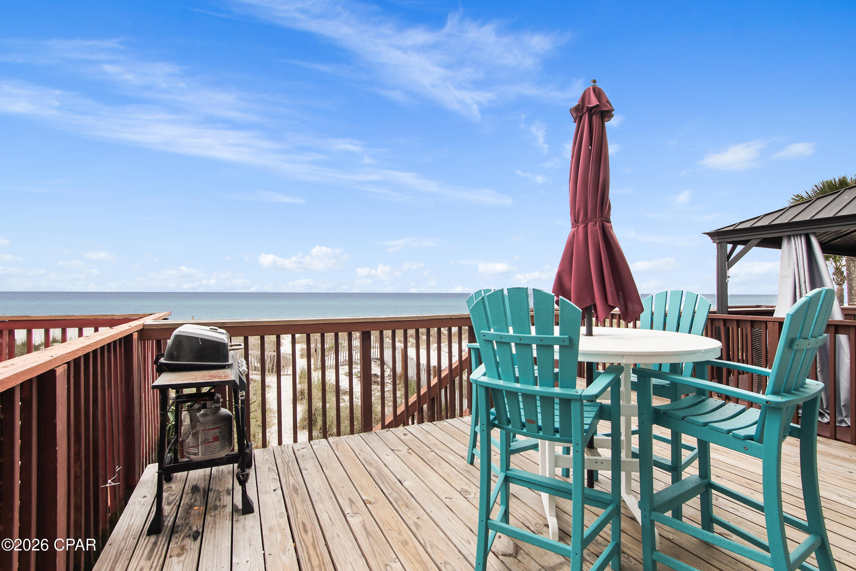 GROSS RENTALS OVER $100,000 IN 2025.   This townhouse has 10' ceilings in the living room giving it a very open feel.   Large deck GULF FRONT with private walk way to the beach.    Located at the intersection of Hwy 79 and Front Beach Road.   This is a BEACH-FRONT TOWNHOUSE WITH NO HOA DUES.   Master bedroom is GULF-FRONT.    Lots of updates throughout, including bathrooms and flooring.   3 full bedrooms, 3 full bathrooms.