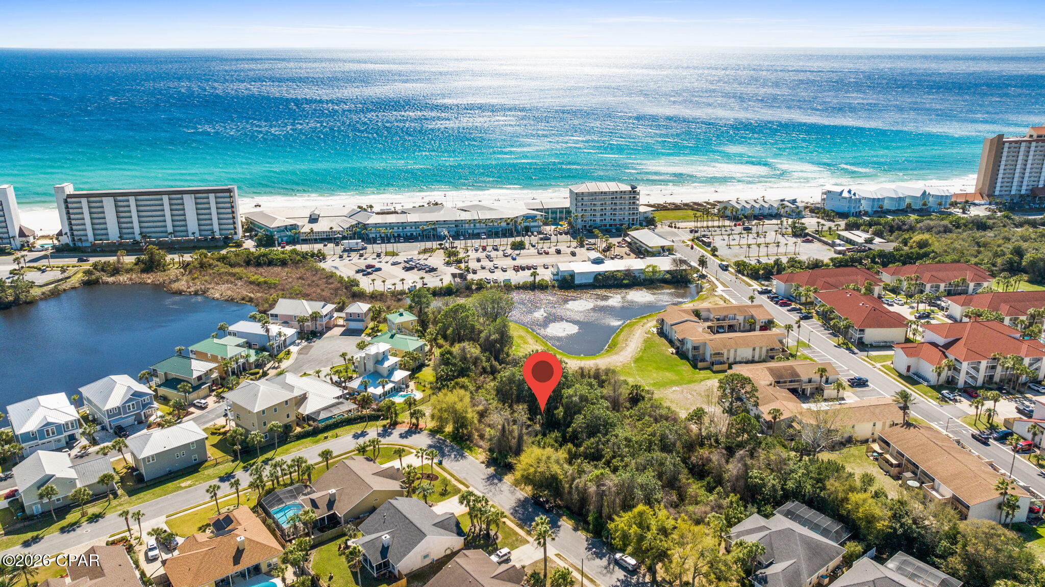 Don't miss the chance to build your dream coastal retreat and wake up to breathtaking Gulf views from one of the last remaining premium lots in the Summer Breeze community. Imagine relaxing on your future balcony, taking in the stunning Gulf visible from approximately 20 feet of elevation. Offering the perfect backdrop for sunrise coffees and sunset evenings.

This exceptional homesite is made even more desirable by the HOA-owned land to the south. Helping preserve your view and adding privacy. With low HOA fees and underground utilities already in place, you'll enjoy both convenience and peace of mind.

The seller also has house plans available for a thoughtfully designed 3-bedroom, 2-bath home, giving you a head start on building your ideal beach getaway.

Ideally located just moments from Beach Access 66, you'll have quick and easy access to the sugar white sands and emerald waters. Plus, you're only a short drive from the shopping, dining, and entertainment options of Pier Park.

Opportunities like this are rare! Secure one of the last lots in Summer Breeze and start building your coastal lifestyle today