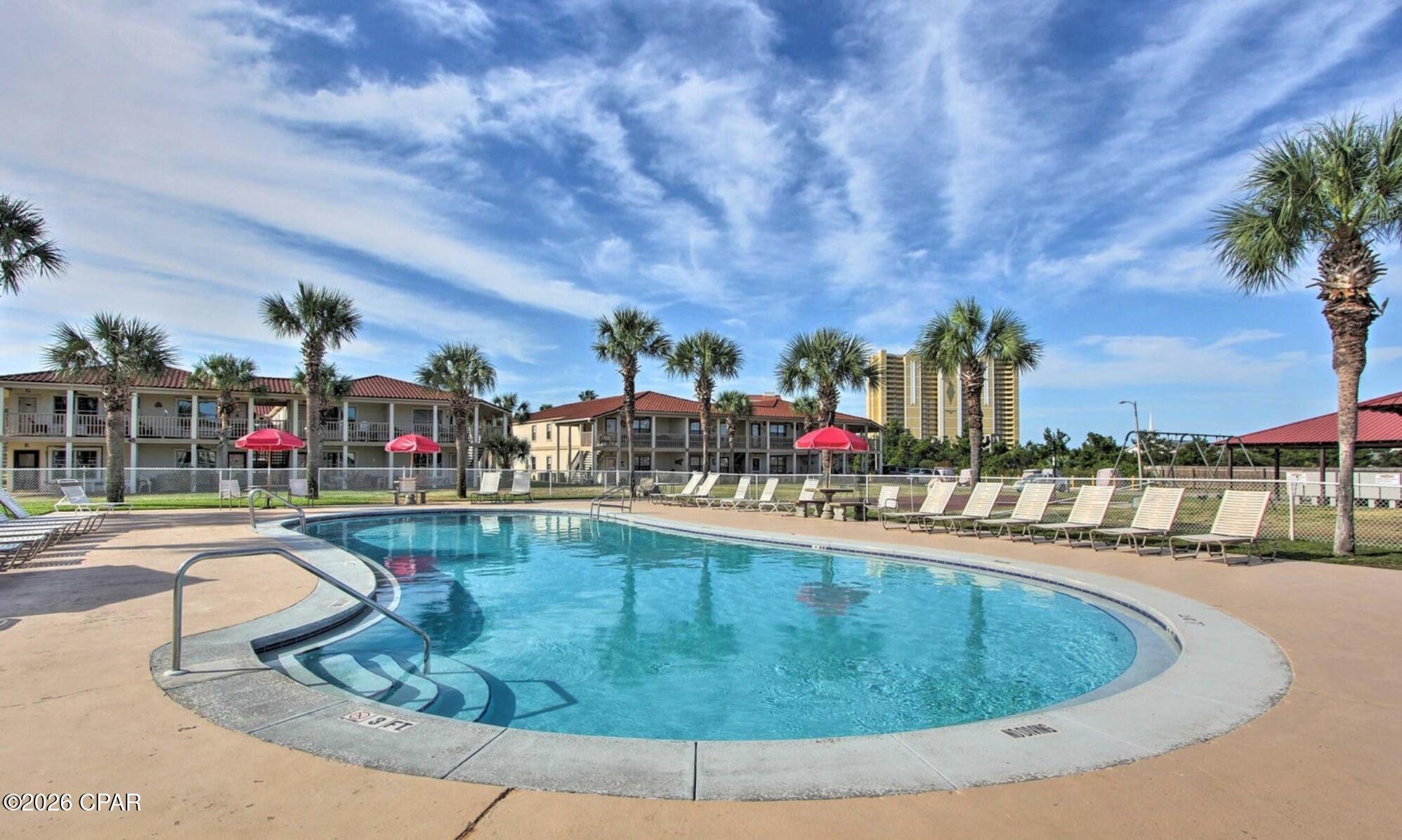 *Beach Condo investment opportunity with proven rental history! Fully furnished 2BR/2BA unit in the gated neighborhood of Horizon South. Outdoor space with privacy fence. Golf cart friendly with plenty of parking spots close to the beach or short walk to the beach.
Updates include stainless refrigerator, AC 2021, updated water heater.

Owners and guests alike enjoy access to an  array of resort-style amenities, including a private beach entrance, mini golf, four swimming pools (one heated for year-round use), hot tub, fitness center, game room, and community spaces. Stay active with tennis courts, basketball, and shuffleboard--all within this gated community.

Rental history available upon request. All measurements are approximate and should be verified if important.