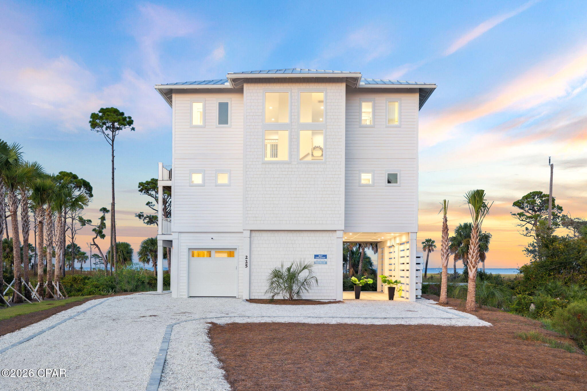 BAY DREAM ESCAPE!!  Discover the ultimate Forgotten Coast escape in this beautifully appointed 4 Bedroom/4.5 Bath home nestled in the exclusive gated community of Park Point. Perfectly positioned at the quiet northern end of Cape San Blas where the neighborhood meets the breathtaking St. Joseph Peninsula State Park, this exceptional home offers a level of privacy, natural beauty & tranquility that's nearly impossible to find. Wake each morning to sweeping views of St. Joseph Bay, spend your days exploring miles of untouched sugar-white beaches, then end every evening with some of the most spectacular sunsets. With beach access only an 8-minute walk away, you'll enjoy endless days of shelling, swimming, fishing, paddleboarding, kayaking & long peaceful walks along one of the most pristine stretches of coastline in the state. Designed for effortless coastal living, this thoughtfully crafted three-story home features an elevator providing convenient access to every level, making it ideal for guests of all ages. The spacious open floor plan is filled with natural light from expansive picture windows that perfectly frame the beautiful bay views. The chef-inspired kitchen is equipped with premium appliances, abundant counter space, custom cabinetry & a large breakfast bar that flows seamlessly into the dining & living areas, creating the perfect gathering space for entertaining family & friends. The inviting living room opens to a screened porch where you'll enjoy cool Gulf breezes, comfortable seating & spectacular sunsets over St. Joseph Bay.  The primary suite features a king bed, spa-inspired ensuite bath & shared access to a furnished bay-view balcony. Two additional queen guest suites each include private baths as well as a spacious bunk room & private bath--perfect for kids or extra guests. A convenient laundry room & coffee/wine bar complete the bedroom level, adding thoughtful touches throughout. The fun continues on the ground level where the oversized garage has been transformed into an incredible recreation space with a refrigerator for cold drinks after a day at the beach. Outside, gather around the fire pit to roast marshmallows under the stars, rinse away the salt & sand in the outdoor shower, or simply relax while planning tomorrow's adventure. With ample parking, deeded beach access, nearby hiking & biking trails, world-class fishing, kayaking, paddleboarding & boating just minutes away, this exceptional home offers everything buyers seek in a primary residence, second home or highly desirable vacation rental investment. Just a short drive to the charming coastal town of Port St. Joe, where small-town hospitality meets endless recreation.  Here, you truly enjoy the best of both worlds--unspoiled natural beauty at your doorstep with all the shopping, dining, entertainment & conveniences of Port St. Joe just minutes away. Call for your private tour & LIVE THE BEACH LIFE!