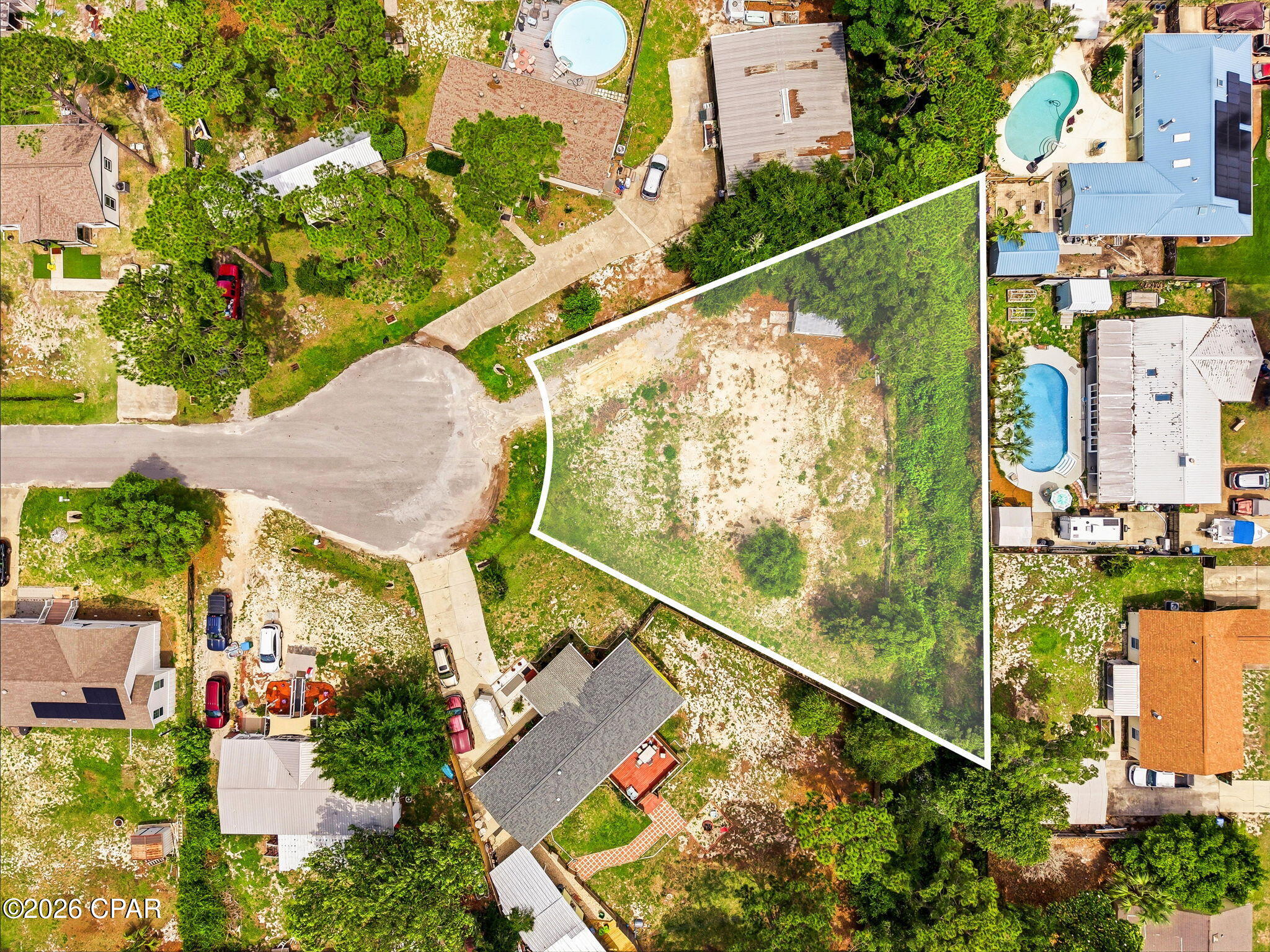 Multifamily allowed! Build your dream coastal retreat or investment property at 2526 Shady Oak Court, a prime vacant lot tucked away in the desirable North Lagoon area of Panama City Beach. Situated on a quiet cul-de-sac, this versatile homesite presents an exceptional opportunity for a custom single-family residence or multifamily development, making it ideal for both homeowners and investors alike.
Perfectly positioned just minutes from the white-sand beaches of the Gulf, this property offers the ideal balance of privacy and convenience. Enjoy easy access to St. Andrews State Park, nearby marinas, public boat launches, waterfront dining, shopping, and all the attractions that make beachside living so desirable.

With the potential for multifamily construction, this lot offers an excellent opportunity for long-term rental income, multi-generational living, or maximizing your investment in one of Panama City Beach's most sought-after locations. Nestled in an established neighborhood surrounded by beautiful homes, this is a rare chance to secure land with flexibility and strong future potential.

Whether you're looking to build your primary residence, vacation getaway, or income-producing property, this lot offers endless possibilities in the heart of Panama City Beach. Don't miss your opportunity to create something special in a location where lifestyle and investment potential come together.