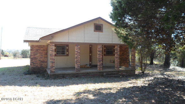 Brick home on 3.2 Acres. 2 Bed 1 Bath home with front and back porch, kitchen and dining area, large utility room and new wiring. Property has large oak, cedar and other variety of trees. Well has no pump, heating and cooling system would need to be check out.