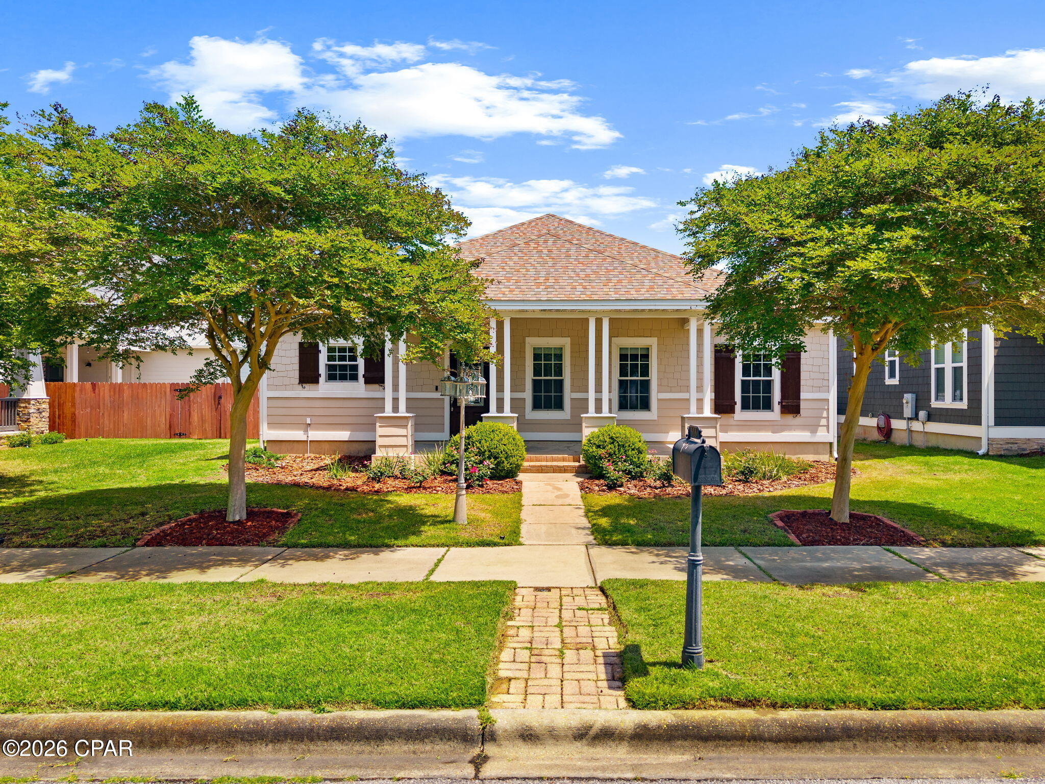 Welcome home to 303 Coral Gables Street in Panama City Beach. This 3 bedroom, 2 bathroom single-story Craftsman style home is located in the highly sought-after Tapestry Park community--a charming, family-friendly neighborhood known for tree-lined streets, front porch living, and resort-style amenities. This beautifully maintained home offers comfortable coastal living just minutes from the white-sand beaches of the Gulf of Mexico, making it ideal as a primary residence, second home, or beach-area retreat.

Tapestry Park residents enjoy exceptional neighborhood amenities including a resort-style community pool, clubhouse, basketball and tennis/pickleball courts, and Peacock Park playground, creating a vibrant and welcoming environment for families and neighbors.
Inside, you'll find a bright, open layout designed for easy living and entertaining, with inviting indoor and outdoor spaces perfect for enjoying family time and relaxing after a day at the beach. The primary suite is a sanctuary - with a custom walk-in closet and en-suite bath that features dual vanities with granite countertop, a step in shower, and separate jacuzzi tub. 

The two car garage has shelving to store your seasonal collections and leads into a rear foyer/flex space conveniently next to the large laundry room with washer and dryer included.

The welcoming front porch adds to the neighborhood's classic coastal charm and encourages connection with the friendly community.

Conveniently located in Panama City Beach near shopping, dining, entertainment, and top local attractions, this home offers the perfect balance of coastal lifestyle, community amenities, and everyday convenience - all just 1/2 mile to the sugar sand and emerald water.