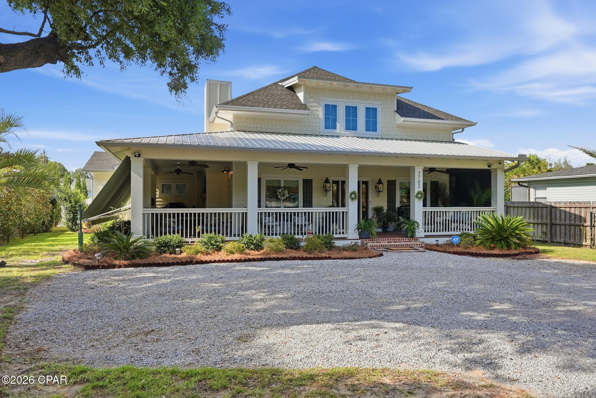 OPEN SUNDAY JULY 12TH 2-4:00 PM. Welcome to your dream coastal retreat, beautifully designed around a classic Southern Living floor plan that perfectly blends traditional southern hospitality with a relaxed, modern coastal lifestyle. Located in a quiet bayside neighborhood just off SCENIC BEACH DRIVE with an easy walk to the shoreline and area parks or a quick golf cart trip to the historic ST ANDREWS shops and dining!
Step inside this custom 2019-built home offering 2,900 square feet of meticulously designed space. The beautiful, light-filled living and dining areas immediately impress with rich hardwood flooring, crisp crown molding, and a cozy fireplace that anchors the room. 
At the heart of the home is a CHEF'S KITCHEN  engineered for the culinary enthusiast. It features custom cabinetry, elegant quartz countertops, a massive center island, a gas cooktop, double built-in ovens, and a premium, seamlessly integrated Liebherr refrigerator.
The thoughtful layout accommodates a main floor primary suite that serves as a private sanctuary. It features a fantastic, storage-filled walk-in closet and an attached spa-like bath with a double quartz vanity, a deep soaking tub, and a luxurious walk-in shower. 
Upstairs offers two dedicated guest bedrooms plus two additional large bonus spaces offering   flexibility--perfect for a dedicated home office, playroom or home gym.
Southern living is truly defined by the seamless indoor-outdoor flow. Expand your entertaining footprint with over 700 square feet of wrap-around porches. The spectacular outdoor living space comes complete with a gas fireplace and mounted TV, all shaded by a motorized retractable awning for year-round comfort.Built with ultra-durable, low-maintenance Hardie Plank construction and equipped with a whole-house generator, this coastal craftsman offers ultimate structural peace of mind. Best of all, enjoy complete freedom with no HOA fees, no restrictive rules, and no required flood insurance. This is luxury, convenience, and the ultimate in COASTAL LIVING.