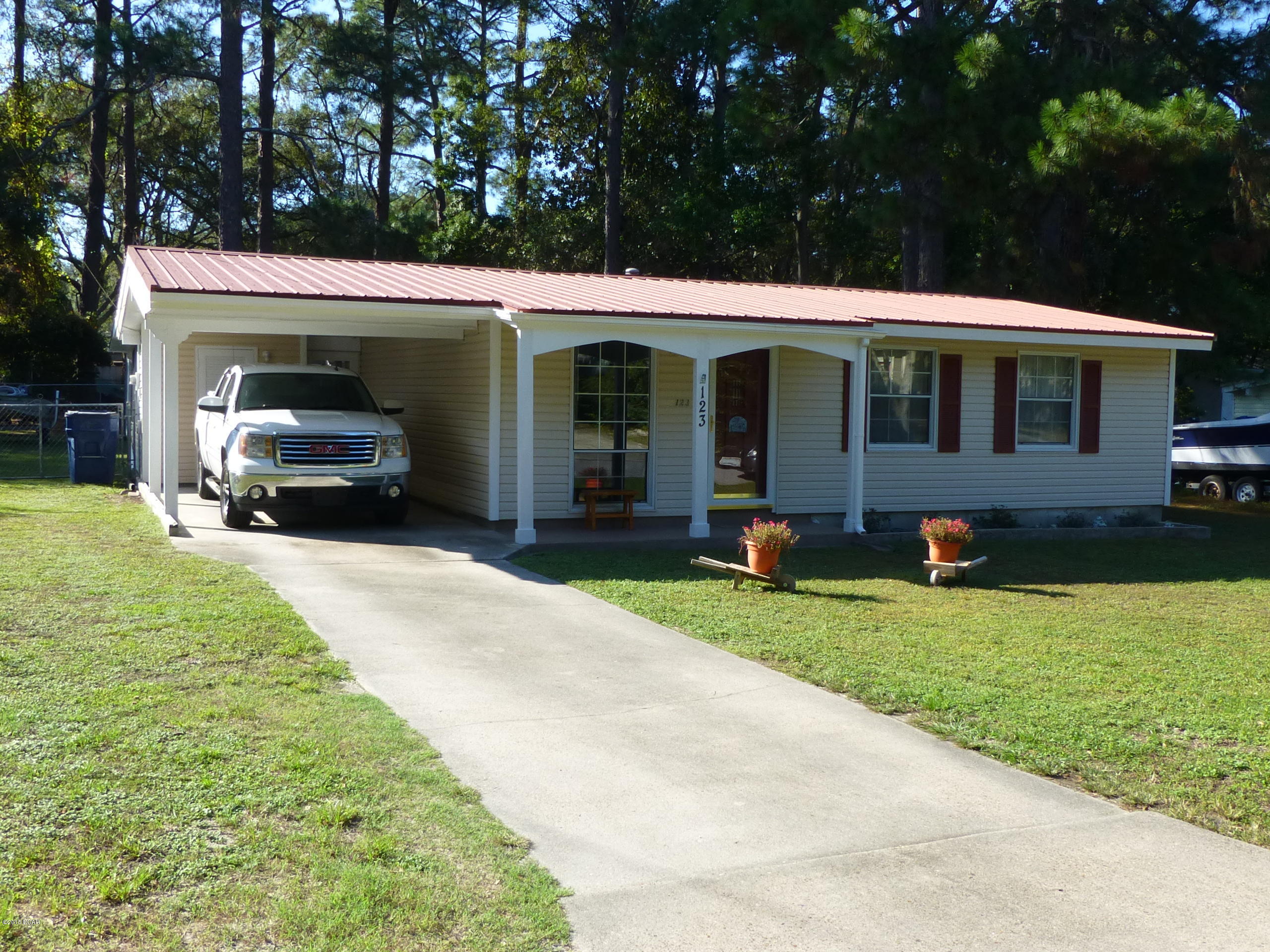 Age, SQ FT, Lot & Room Sizes Approximate * This 2 Bdrm, 1.5 bath home has been completely renovated and as is as neat as a pin * Upgrades include newer roof decking, a metal roof, newer kitchen and bath tile, cabinets and counter tops. Energy efficient Natural Gas HWH, Central Heat and Clothes Dryer * Vinyl siding has 1'' insulation behind it * Newer 13 Seer A/C * Screened back porch * Double gate entrance to 2 car detached garage * 12X10 Storage Building with Metal Roof and Vinyl Siding on 4X6 Skids * This home is clean...no pets or smokers!!!
