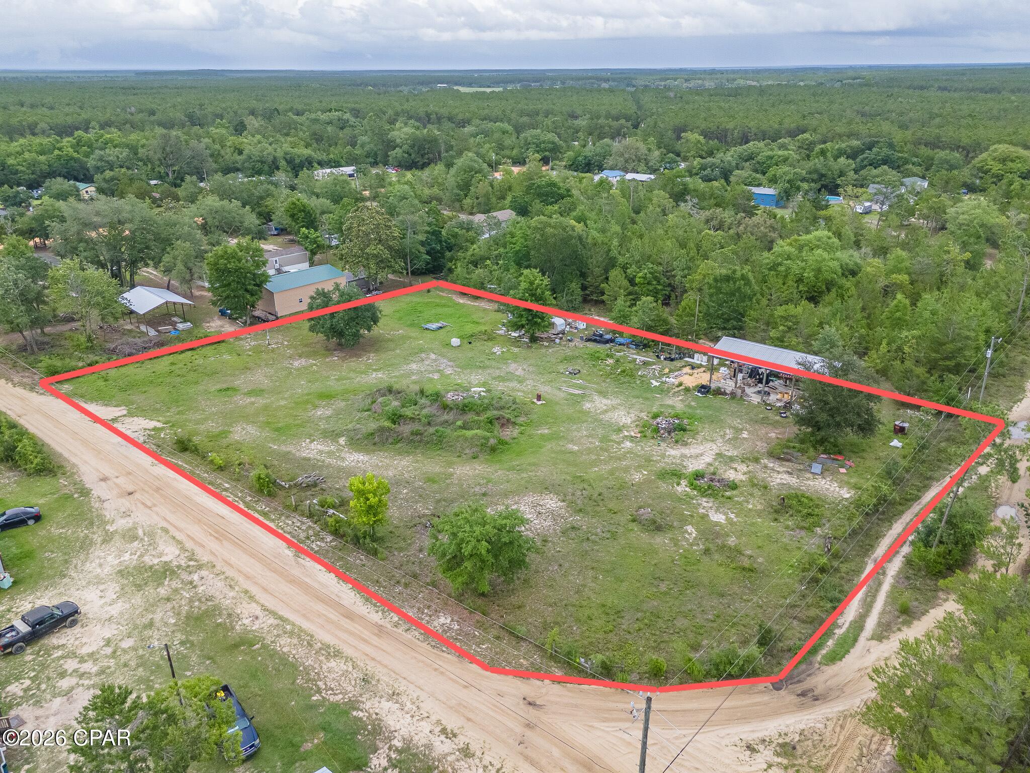 Rare opportunity to own a 1.49-acre homesite in the desirable Southport area of Bay County. This spacious parcel offers plenty of room to build your dream home, detached garage, workshop, or additional storage while enjoying the privacy and tranquility of country living. The property features a substantial 30' x 50' pole barn on a concrete slab, providing excellent space for equipment, vehicles, RV storage, hobbies, or future projects. Power is available nearby, adding to the property's development potential and convenience.
The lot has been cleared, providing a head start for future development and reducing site preparation costs. Conveniently located with easy access to Panama City, shopping, dining, schools, and area amenities. Whether you're ready to build now or looking for an investment in a growing area of Bay County, this property offers outstanding potential.