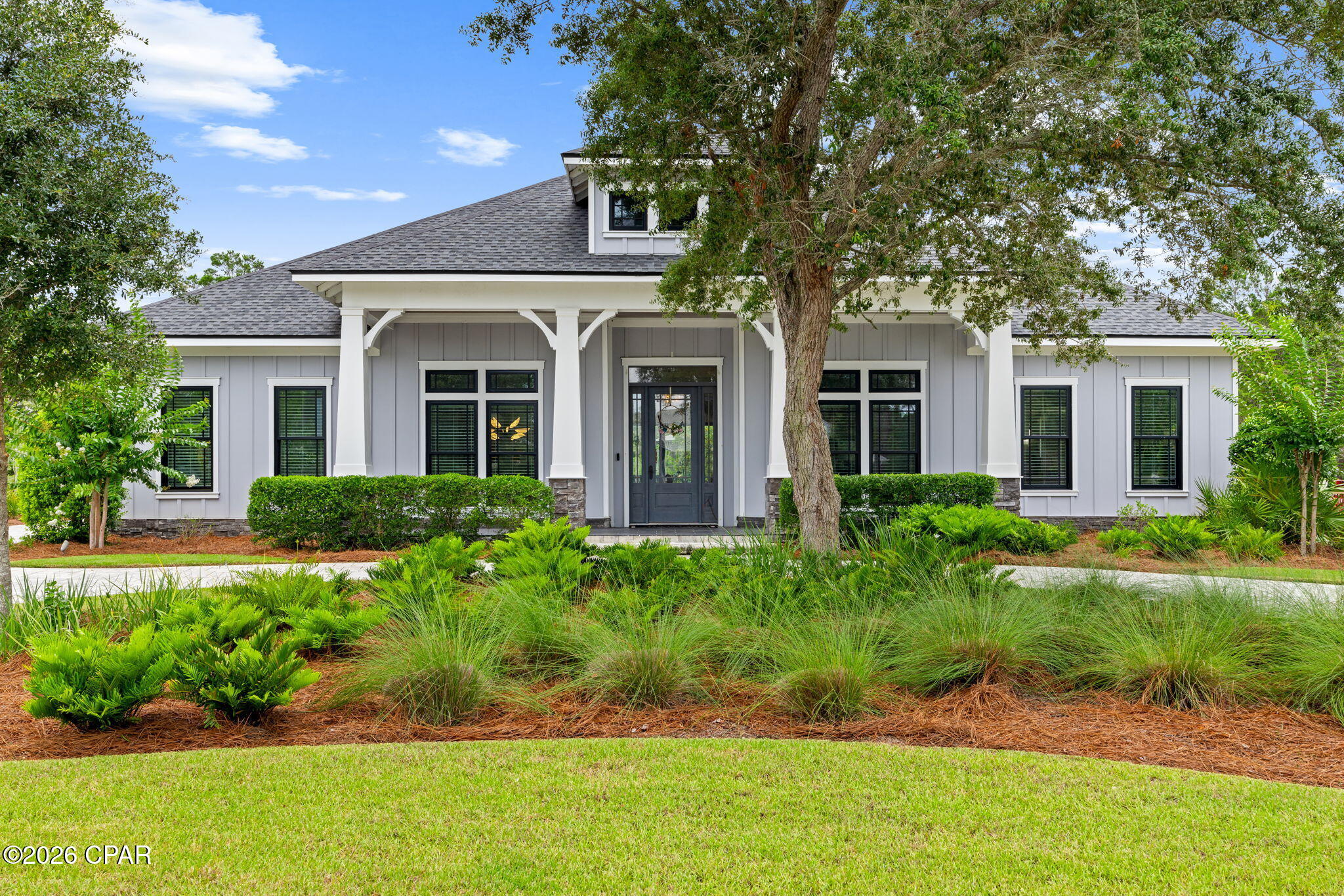 Welcome to 1518 Dune Lake Trail, a stunning custom residence in the prestigious gated community of Wild Heron. Thoughtfully designed with exceptional craftsmanship and upscale finishes throughout, this luxury home offers the perfect blend of elegance, comfort, and coastal sophistication. From the moment you arrive, the beautifully landscaped grounds, paver driveway, and expansive front porch create an impressive first impression. Inside, soaring vaulted ceilings with exposed custom trusses and tongue-and-groove wood accents anchor the spacious open-concept living area, while abundant natural light fills every room. The dramatic floor-to-ceiling fireplace serves as the centerpiece of the great room, creating a warm and inviting atmosphere for both everyday living and entertaining. The chef's kitchen is a showpiece, featuring premium stainless appliances, custom cabinetry, a large center island, designer lighting, wine storage, and abundant workspace for gatherings of any size. The adjoining dining area and seamless indoor-outdoor flow make entertaining effortless. The luxurious primary suite offers a private retreat with a spa-inspired bath complete with a freestanding soaking tub, oversized walk-in shower, dual vanities, and an extraordinary custom walk-in closet. Additional guest accommodations provide comfort and privacy, while a dedicated office offers the perfect work-from-home space. Every detail of this home reflects quality and attention to design, from the custom millwork and crown molding to the designer finishes and thoughtfully curated coastal palette throughout.

Located within Wild Heron, residents enjoy access to world-class amenities including resort-style pool, fitness center, lakefront boathouse, walking trails, and access to Lake Powell, Florida's largest coastal dune lake. Watersound Club members have access to Sharks tooth golf course, clubhouse, & tennis.

Experience luxury living in one of Northwest Florida's most sought-after communities.