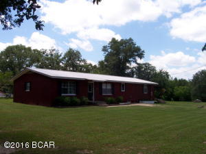 Beautiful Ranch in popular Washington County.This home is located in one of the fastest growing areas of Florida.Very nice home that has been Freshly Painted, totally remodeled and enlarged from original size. Home has three large bedrooms,2 baths and gorgeous eat-in kitchen. New kitchen cabinets made with re-claimed cherry wood from original cabin. Master bedroom has sitting area that opens onto huge covered porch,overlooking Holmes Valley.Large master bath with marble tub.Ranch has large barn with 5 12x12 stalls and cedar tack room,automatic waterers,hay loft and built in feed bins.Fenced and cross fenced.Property has organic garden area with sprinkler system, chicken coop,and beautiful pastures Huge heritage oak tree.This home and is a must see,look at the pictures. Not far from new PC​​‌​​​​‌​‌​​​​‌​​‌​​​​‌‌ Airport