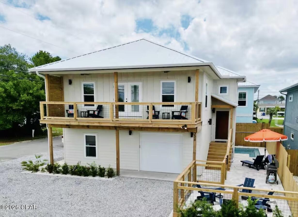 Seller is offering $15k at closing for the addition of a full bathroom on the 1st floor!! 

Turnkey Panama City Beach investment opportunity just minutes from the Gulf! This spacious 4-bedroom, 2.5-bath coastal home is ideally suited for a short-term rental, second home, or full-time residence and comfortably accommodates up to 12 guests.

The thoughtfully designed two-story layout features an open-concept living area, a well-equipped kitchen with ample seating, and a dining space perfect for hosting larger groups. The main-level primary suite includes a walk-in closet, double vanity, and walk-in shower. Upstairs living spaces open to a private balcony--perfect for enjoying coastal breezes after a day at the beach.

Downstairs you'll find additional guest bedrooms including a large bunk room designed for fun and functionality, making the home ideal for vacation rental guests and larger families. Multiple smart TVs, workspace areas, and high-speed internet provide comfort for both vacationers and remote workers.

Outside, enjoy your private fenced backyard retreat complete with a plunge pool, fire pit, grilling area, and lounge space--perfect for relaxing evenings and memorable beach vacations.

Conveniently located just 8 minutes from Pier Park and about 10 minutes to Rosemary Beach and Scenic Highway 30A, Top Golf, Dolly Parton's Pirate Voyage, and Camp Helen State Park this home offers easy access to some of the Emerald Coast's most popular dining, shopping, beaches, and entertainment.

With parking for multiple vehicles and a layout designed to host larger groups, this property presents an excellent opportunity for buyers seeking a Panama City Beach vacation home with strong short-term rental appeal.