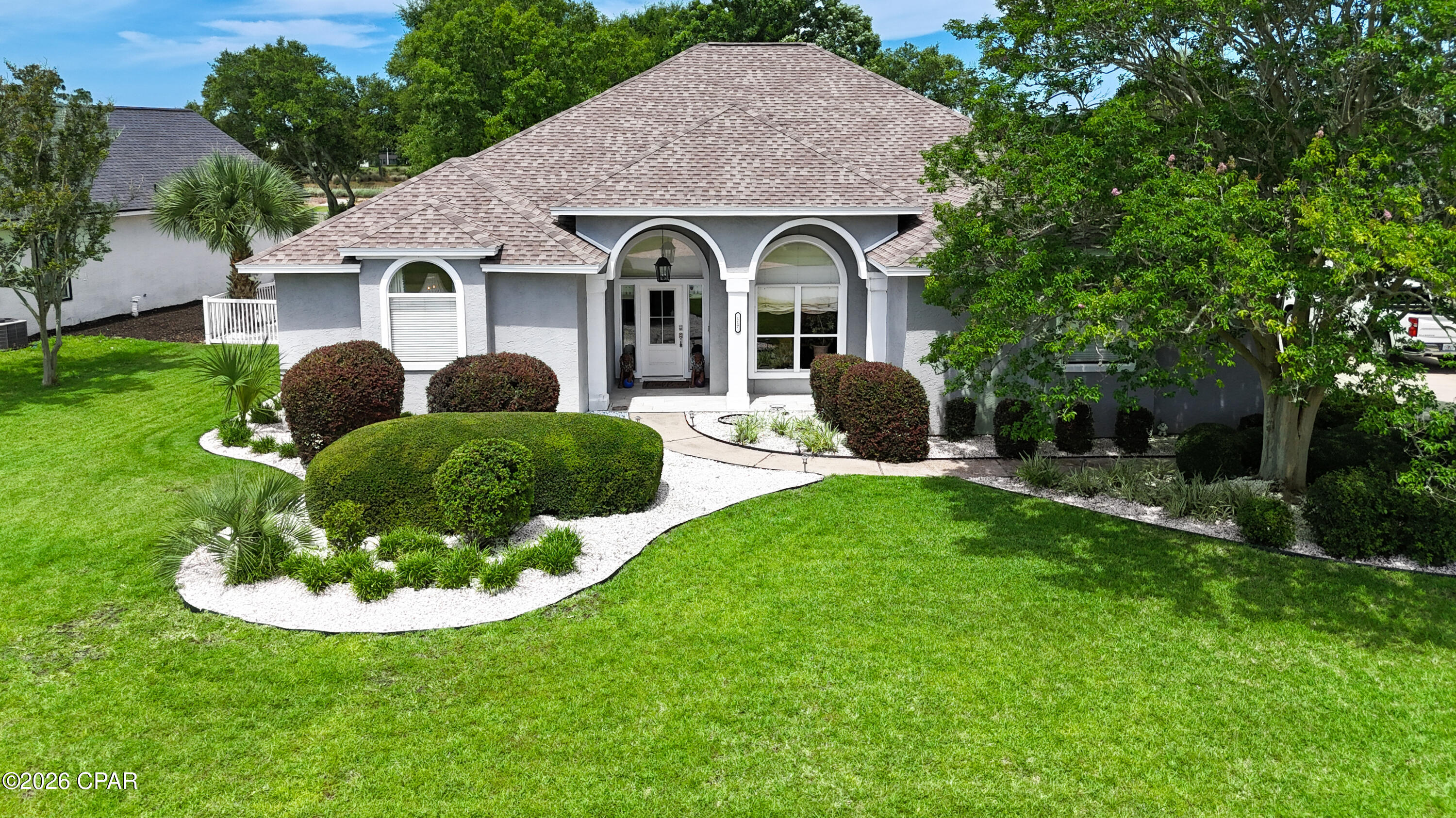 GOLF COURSE LIVING IN BAY POINT'S PREMIER GATED COMMUNITY! Located in the desirable Legend Lake neighborhood and overlooking the Jack Nicklaus Signature Golf Course, this meticulously maintained single-level home offers the perfect blend of comfort, privacy, and resort-style living. Featuring 10-foot ceilings, luxury vinyl plank flooring throughout, and custom shiplap accents, this thoughtfully designed home is ideal for both everyday living and entertaining.
Upon entering, you're welcomed by an elegant front living space with soaring ceilings and expansive windows, offering endless possibilities as a grand piano room, private library, home office, or sophisticated gathering area. The beautifully updated chef's kitchen serves as the heart of the home, featuring custom cabinetry, granite countertops, a spacious center island, farmhouse sink, designer lighting, stainless steel appliances, a separate ice maker, and abundant storage.
Open to the kitchen, the impressive family room showcases dramatic beamed ceilings, a cozy gas fireplace, and a wall of windows framing picturesque views of the private pool and the Jack Nicklaus Signature Golf Course beyond. The large screened porch creates the perfect indoor-outdoor living experience, offering ample space to entertain, relax in the hot tub, and enjoy breathtaking sunsets over the fairway.
The primary suite serves as a private retreat, offering peaceful views of the sparkling pool and backyard oasis, private access to the screened porch, dual walk-in closets, and a spa-inspired bath complete with a soaking tub. Additional highlights include updated bathrooms, custom closets, extensive crown molding, a two-car garage, and double gate access to the fully fenced backyard for storing a boat, trailer, or jet skis.
Step outside to your private backyard retreat featuring a sparkling pool, hot tub, mature landscaping, and panoramic golf course views. Bay Point residents enjoy 24-hour gated security, championship golf, a full-service marina, waterfront dining, walking and biking paths, golf cart-friendly streets, and an active social lifestyle with clubs, events, and live entertainment. Whether you're seeking a primary residence, retirement retreat, or second home, this is a rare opportunity to experience the very best of Bay Point living.