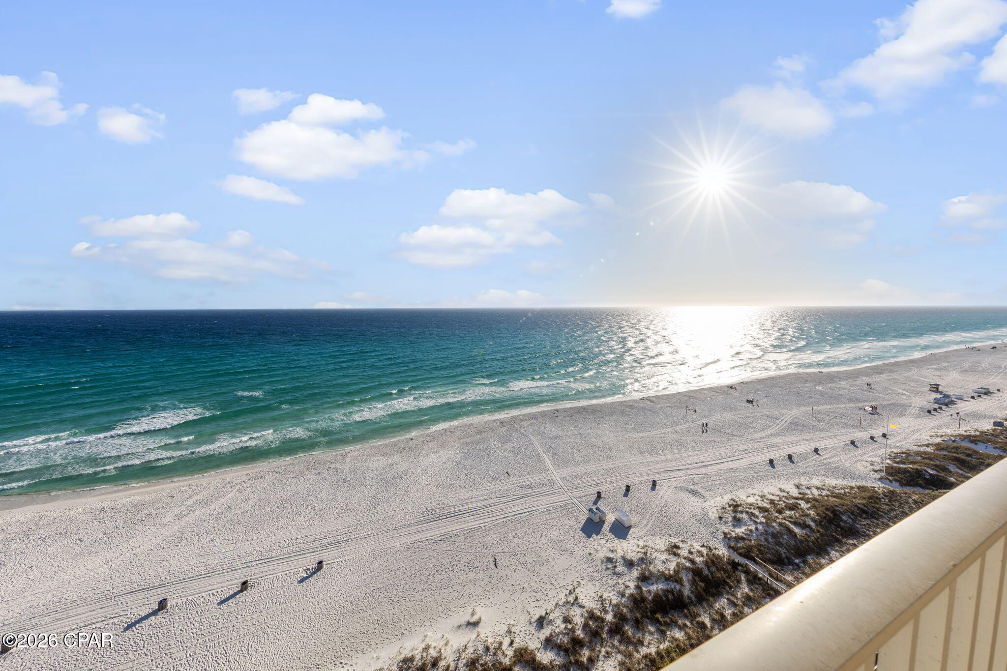 Welcome to Grande Surf Club--an exclusive Gulf-front retreat where low-density living meets elevated coastal comfort. With only 28 residences and just two per floor, this intimate community offers a rare level of privacy along one of Panama City Beach's most desirable stretches of coastline.

This west-end 3-bedroom, 2-bath residence features a spacious, open layout filled with natural light and a wraparound balcony showcasing sweeping coastline views from sunrise to sunset. From the tranquil jetties to the endless Gulf horizon, the backdrop is nothing short of spectacular. The expansive living area flows seamlessly to the balcony, creating the perfect setting for entertaining or simply relaxing to the sound of the waves.

The Gulf-front primary suite serves as a private retreat with direct balcony access, dual walk-in closets, double vanities, a jetted soaking tub, and a separate tiled shower--designed for comfort and relaxation.

A standout feature of this residence is the covered parking space located under the building, a highly desirable upgrade valued at approximately $50,000--offering both convenience and protection that many units simply do not have.

Residents of Grande Surf Club enjoy a heated beachfront pool and a pristine, uncrowded shoreline just steps away. Despite the peaceful, tucked-away feel, you're just a short beach stroll from dining, entertainment, and the upcoming Tootsies venue--blending privacy with accessibility.

Recent building enhancements include a complete exterior paint and seal (2024), new fire control system (2025), new domestic water pump, and all structural engineering and elevator inspections current as of 2025--providing confidence in the building's quality and upkeep.

Whether you're seeking a full-time residence, second home, or investment opportunity, this is Gulf-front living at its best--refined, private, and truly hard to find in today's market.