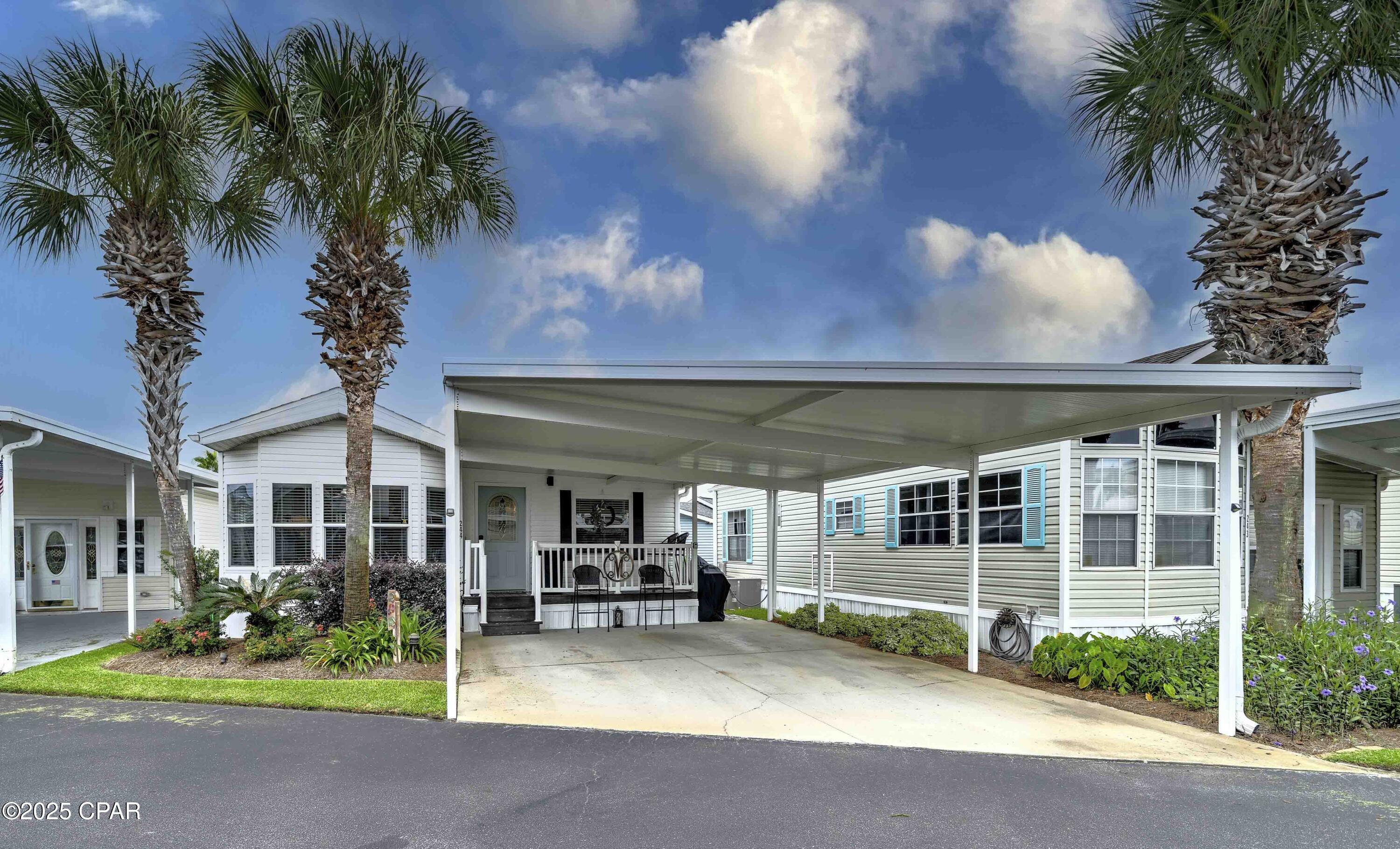 Experience the ultimate in coastal living in this beautifully updated beach home located in Emerald Pointe Resort. With two bedrooms and two bathrooms, this well-maintained property comes fully furnished and is move-in ready for you and your family to begin making memories! The interior features a tasteful coastal design, a roomy living space with easy access and only one step inside, a large open kitchen with added cabinet space, a roomy dining area, a generously sized master suite, indoor laundry room, owner's closet, and an attached carport offering ample parking. There's also covered patio in front and an inviting open patio at the back. Whether you're looking for a full-time residence, a vacation getaway, or a smart investment, this residence provides comfort and convenience just moments from local attractions. Emerald Pointe Resort is a golf cart friendly, gated community located in the heart of Panama City Beach close to restaurants, shopping, and the world's most beautiful beaches. Amenities include a large clubhouse, exercise room, 2 pools (one heated seasonally), hot tub, lake with boardwalk, and shuffleboard court. HOA fee includes water, sewer, garbage, cable, and lawn service. This charming property won't last long, schedule your showing today and make it your perfect beach retreat! All details including age, square footage, lot, and room sizes are approximate and should be verified if important.