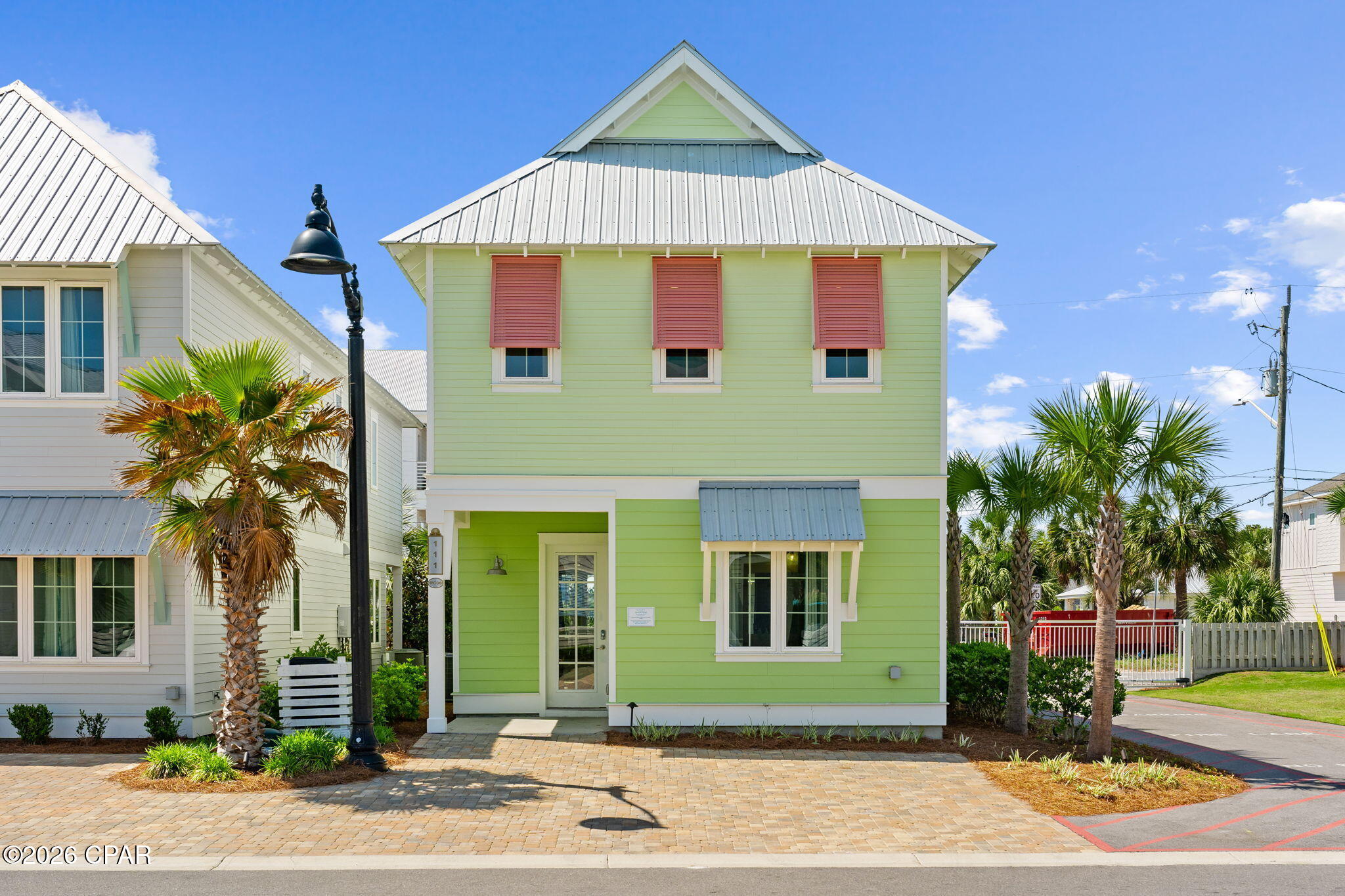 Welcome to 111 Paradise Found, a beautifully appointed coastal retreat located within the highly sought-after Margaritaville Beach Cottage Resort. This property offers the perfect blend of comfort, style, and location.  Step inside to find a bright, open-concept layout designed for relaxed coastal living, featuring spacious living areas, abundant natural light, and seamless flow for entertaining. The well-equipped kitchen opens to the main living space, creating an inviting atmosphere for gatherings with family and guests.
Enjoy the Florida lifestyle outdoors with private space perfect for morning coffee or evening relaxation. As part of Margaritaville, residents and guests experience resort-style amenities, a laid-back island atmosphere, and easy access to the sugar-white sands and emerald waters of the Gulf.
Whether you're looking to generate rental income or secure your own piece of paradise in one of Panama City Beach's premier resort communities. 

The home features 5 bedrooms and 4.5 baths. The open concept first floor has a chef's kitchen with huge island, quartz countertops, soft close maple cabinets, and stainless Frigidaire appliances including a six-burner gas cooktop. The first floor also features one of two primary bedrooms with a king size bed and ensuite bath. Upstairs you'll find the second primary bedroom with a king size bed and ensuite bath, a queen bedroom with an ensuite bath and two additional queen bedrooms with a large, shared bath. The first floor patio features a dining table and large hot tub and the second level balcony features generous seating and partial gulf views. There is room for three vehicles to park on the paver driveway. This floorplan is perfect for families to enjoy. Margaritaville Beach Cottage Resort offers owners and their guests a true resort with fantastic amenities and services. Float along the 425 foot long lazy river, enjoy the water slides, relax in the huge oasis pool, or enjoy a cheeseburger and margarita at the poolside bar and grill. And let's not forget you can also enjoy 580 feet of dedicated beachfront offering a full suite of beach services, emerald green waters and soft sandy beaches!  Enjoy a full service restaurant, fitness center, arcade and more! Margaritaville Beach Cottage Resort is a short-term rental community with every amenity a guest would love to enjoy while on vacation. Call today to set up your private showing.