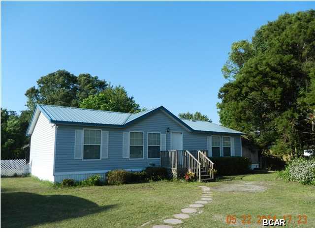 Price Reduction! You must see this home! 3BR/2BA manufactured home on a dead end street. Two mature oaks, a southern cedar tree, crepe myrtle, magnolias, gardenias, and azaleas are among the many different plants surrounding this beautiful home. The backyard is spacious with room for extra parking & activities. The inside of the home is as charming as the outside! Master Allure cherry resilient flooring is in the living area and one of the additional bedrooms.Master bedroom includes tranquility resilient flooring, Kitchen has a full size pantry. laundry room is off of the kitchen area, as well as a covered deck through sliding glass doors for enjoying or entertaining. The large shed is equipped with electricity and a carport. Home is within walking distance to Cedar Grove