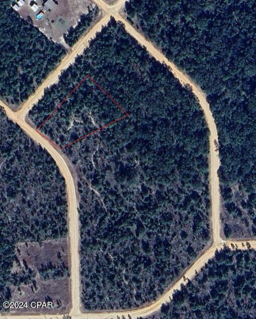 Nice almost 2 acre residential lot in Compass Lake. Compass Lake provides you access to several activities like a pool, driving range, kayaking, private boat ramp, paddle boarding, fishing, swimming, and horseback riding. There are several lakes/ponds in this community with great fishing and swimming. All measurements are Approx and should be verified by buyer. Buyer to obtain survey if needed.