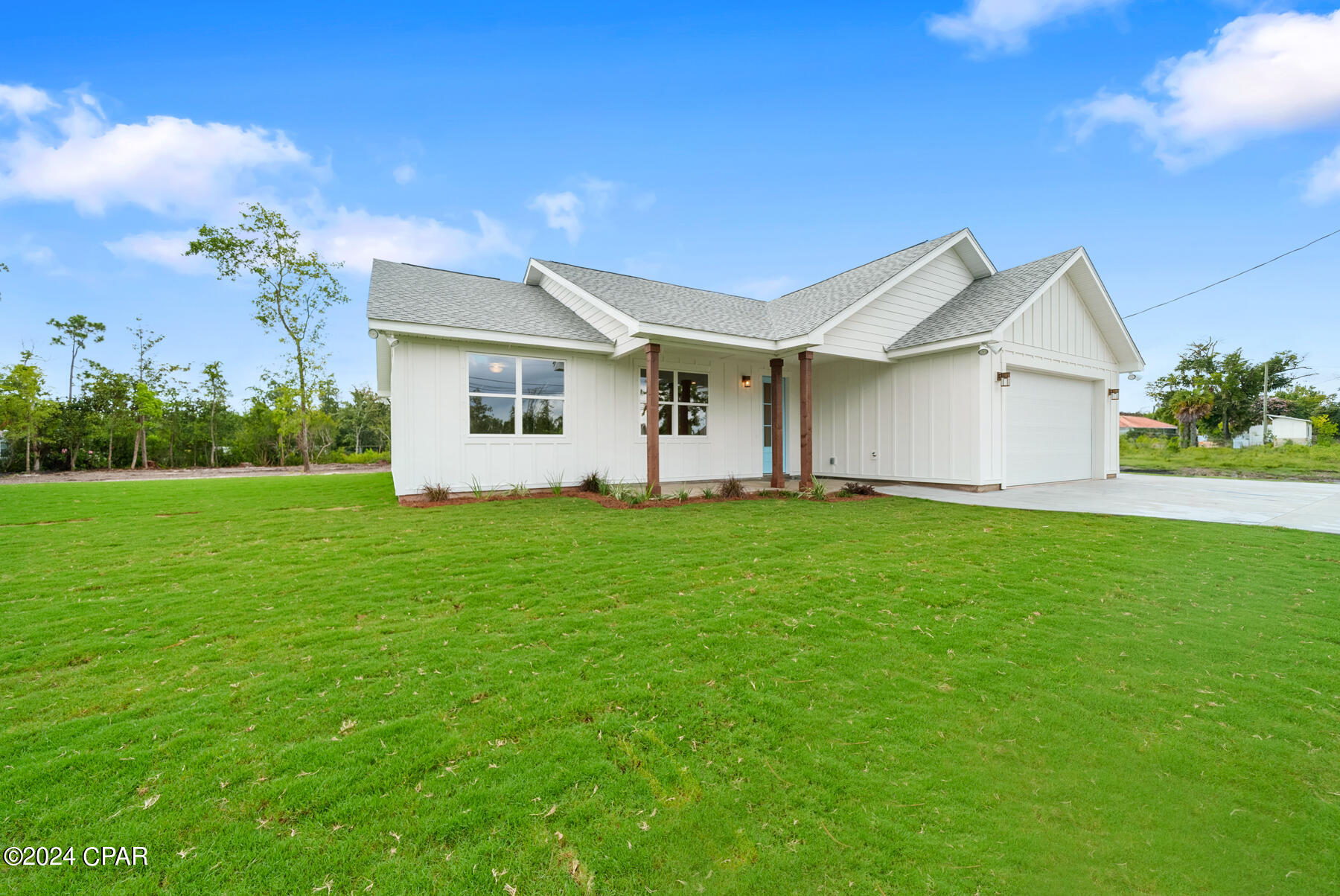CURRENTLY UNDER CONTRACT, SELLER WILL CONSIDER BACKUP OFFERS Discover your dream home in this newly constructed 3-bedroom, 2-bathroom gem, perfectly situated just a 5-minute drive from Tyndall Air Force Base. From the moment you arrive, you'll be captivated by the elegant board and batten siding and the meticulously landscaped yard. Step inside to find a spacious, open floor plan featuring 9-foot ceilings and luxurious vinyl plank flooring throughout. The gourmet kitchen is a chef's delight, boasting high-end countertops and premium finishes that seamlessly blend style and functionality. The bathrooms are a true retreat, with custom tile showers adding a touch of luxury to your daily routine. Designed with modern living in mind, this home also offers extra parking space on the side for your boat or recreational vehicle. Perfect for families and outdoor enthusiasts alike, this property combines convenience, luxury, and impeccable craftsmanship in one unbeatable package. Don't miss your chance to make this stunning house your new home! Measurements are approximate buyer must verify if important.