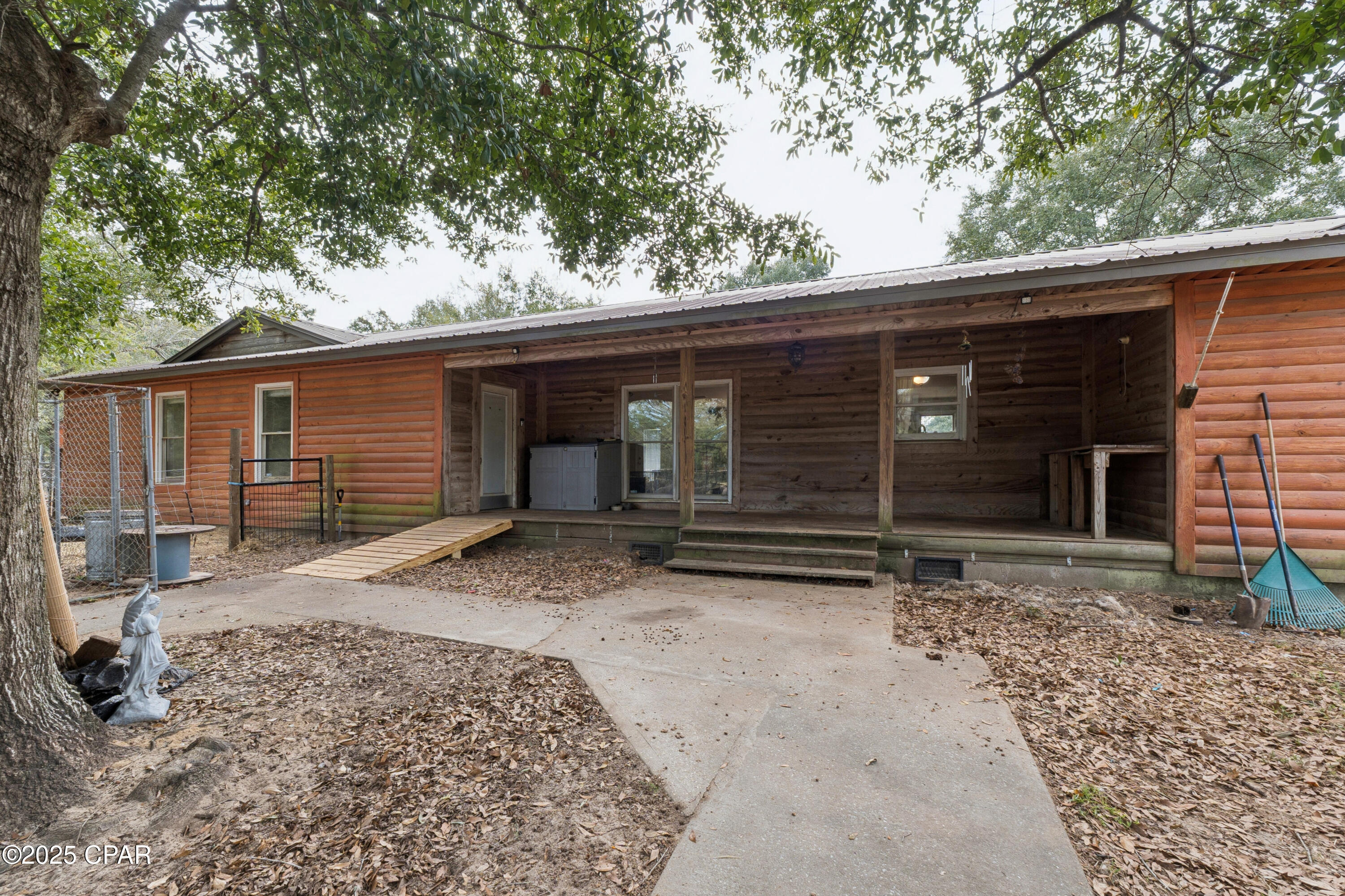 CURRENTLY UNDER CONTRACT, SELLER WILL CONSIDER BACKUP OFFERS. Charming Log Cabin style home on 1 Acre (fenced in) located in Fountain, FL. 

Escape to the peace and quiet of country living with this beautiful log cabin-style home nestled on a spacious 1-acre lot. Ideally located between Highway 20 and Interstate 10, this property offers the perfect blend of privacy and convenience.
 Inside you will find 3 bedrooms and 3 full bathrooms, providing plenty of space for family and guests. Projector mounted in the open living area takes watching movies or sports to another level. Enough parking and inside space to host all family functions. The warm wood tones, rustic charm, and open layout create a cozy, inviting atmosphere that makes you feel right at home. Whether you're relaxing on the porch with your morning coffee or enjoying evenings surrounded by nature, this home is rural Florida living just outside of the city.
If you love the country lifestyle, you won't want to miss this. A space, that offers room to breathe, unwind, and make lasting memories.