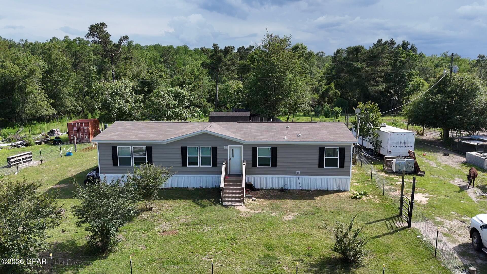 Beautiful 61-acre property set up and ready for livestock, horses, hunting, or country living. Approximately 40 acres are in pasture with the remaining 21 acres in timber, offering an excellent mix of open land and wooded acreage. The property is fully fenced with some cross fencing already in place. Deer are abundant throughout the property, making this a great recreational and hunting tract as well.



Improvements include a massive 40x84 barn featuring 9 stalls, feed room, and hay room, along with two Conex containers (20 ft and 40 ft) providing additional storage space.



The home is a 2024 mobile home offering 4 bedrooms, 2 bathrooms, and approximately 1,456 heated and cooled square feet. Whether you are looking for a working farm, hunting property, or peaceful rural homestead, this property offers endless possibilities.