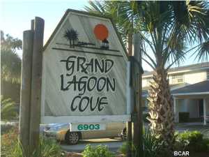 Immaculate waterfront 1 bedroom, 1 bath bottom floor condo located in Grand Lagoon Cove. Rent includes water, sewer, garbage and basic cable(Comcast). Project features in-ground pool and tennis courts. No Pets.