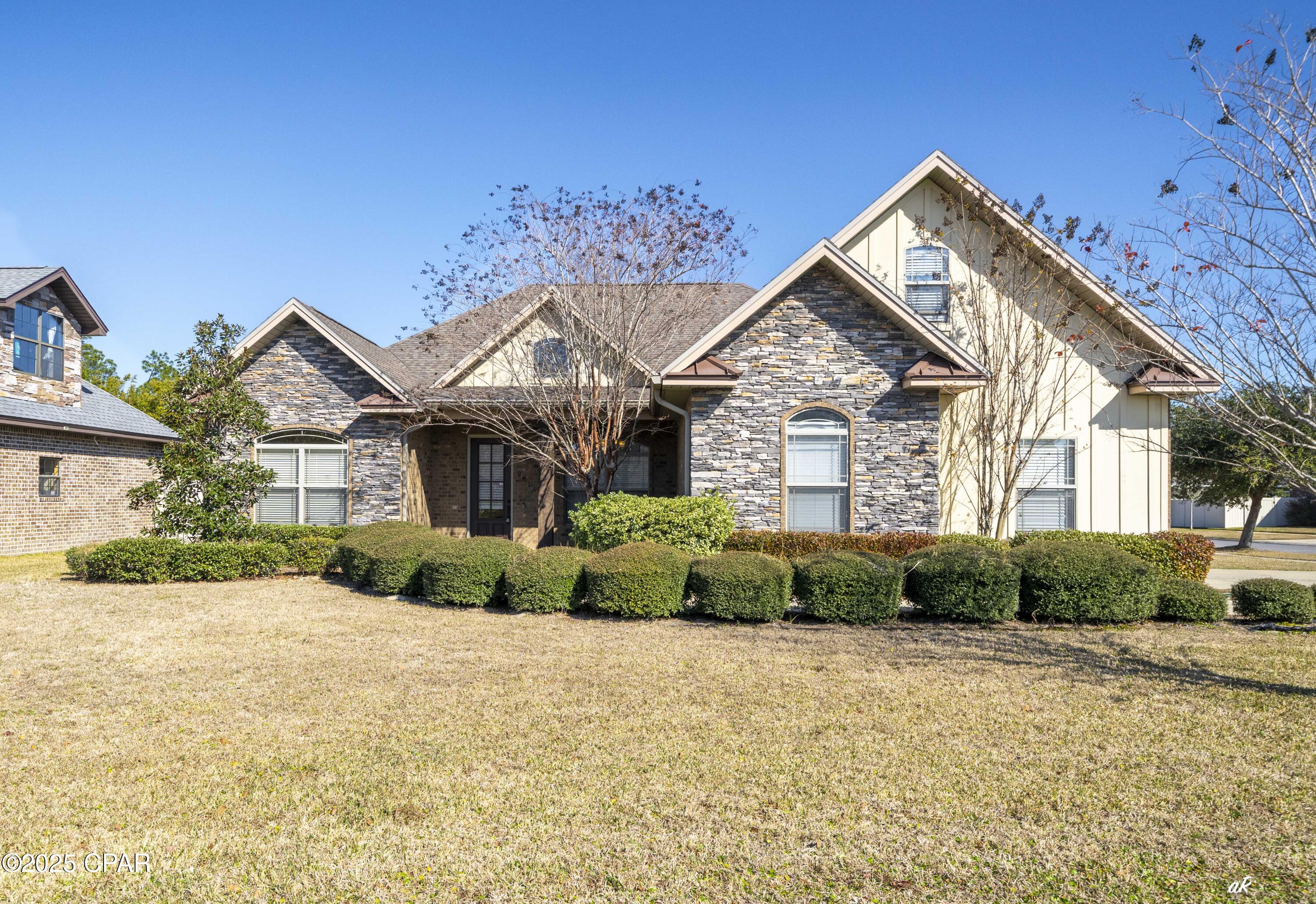 Don't MISS this opportunity to own a beautiful custom home on a corner lot in the highly desirable Hawks Landing subdivision. It features 4 bedrooms with cedar lined closets, 4 full bathrooms, and a large bonus room upstairs. This home has an open floor plan, hardwood floors, ceilings are 9' and 10' high throughout with crown molding and built in bookcases on both sides of the fireplace in the family/living room. The gourmet kitchen features custom cabinets, granite counter tops, stainless steel appliances and a beautiful backsplash. The home has a spacious, screened back patio and a fenced back yard. The home is wired for a generator, and the garage has heavy duty cabinets for extra storage. Dimensions are approximate. Please verify if it is important. Contact your favorite REALTOR today and come take a tour of this home!